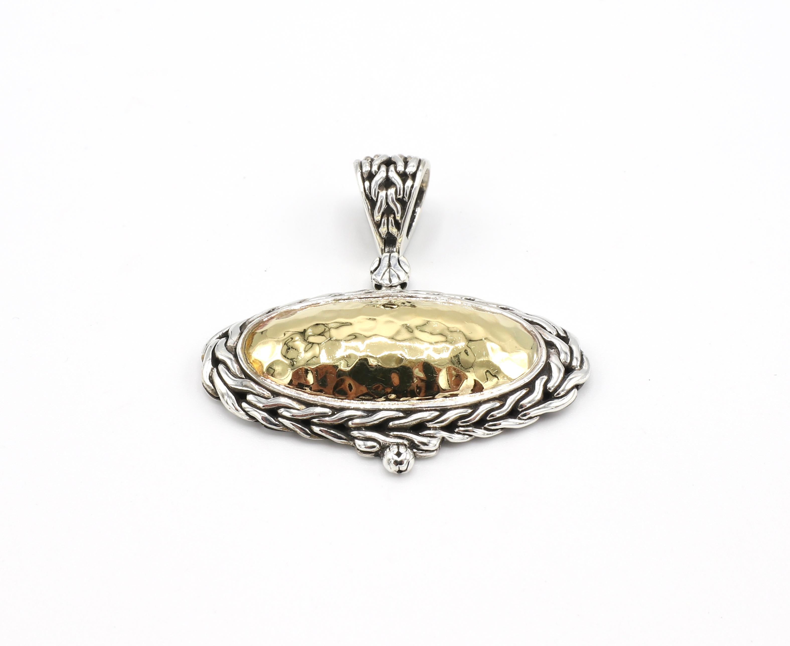 John Hardy Palu Oval Sterling Silver & 22K Gold Hammered Pendant

Metal: Sterling silver & 22k yellow gold
Weight: 14.1 grams
Length (including bale) Approx. 1.5 inches
Width: Approx. 1.6 inches
Signed: 22k 925 JH hallmark
Pendant only