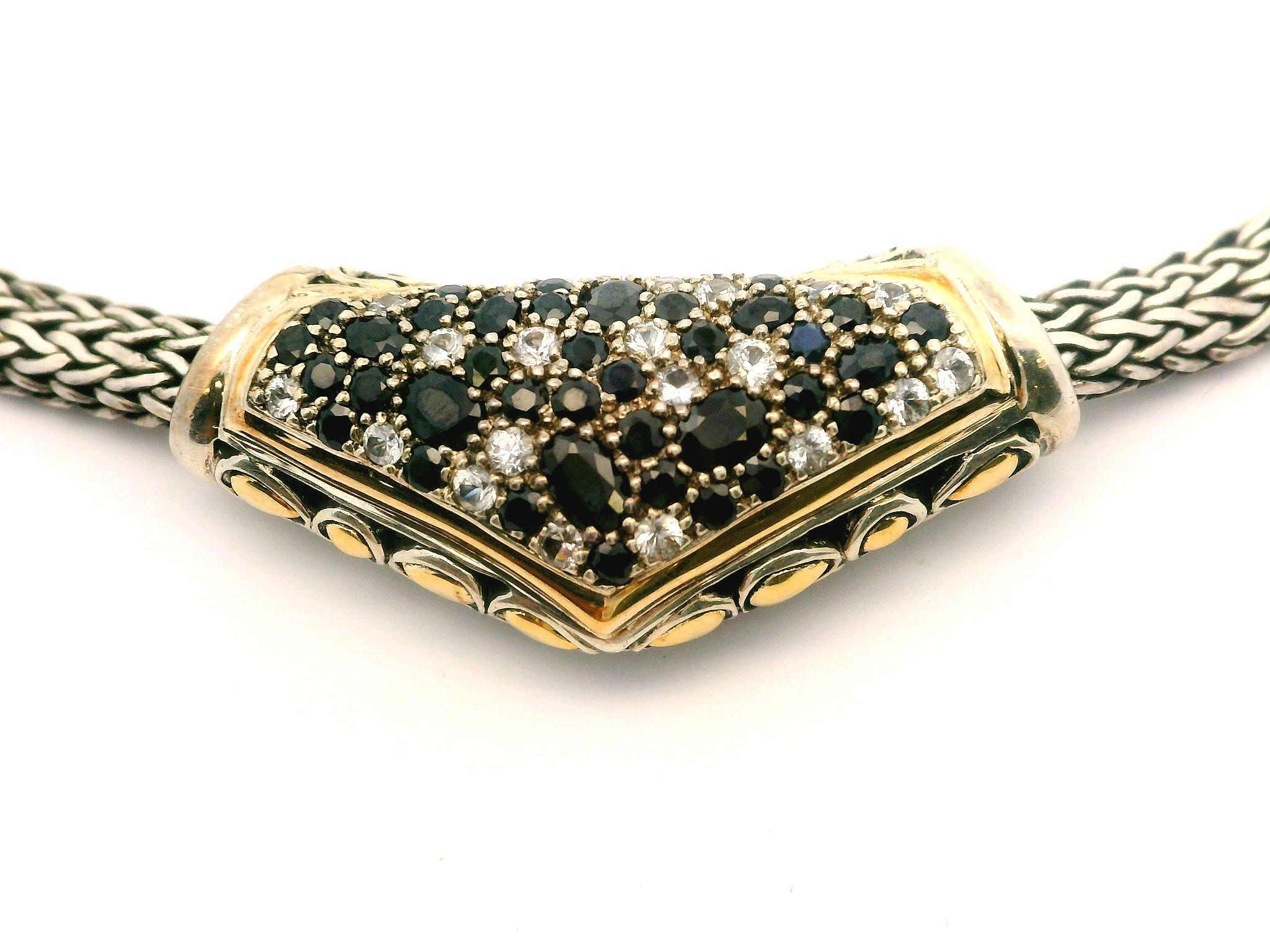 --Stone(s):--
Numerous Natural Genuine Sapphires - Oval & Round Brilliant Cut - Pave Set - White & Very Dark Blue Color 

Material: Solid Sterling Silver & 18k Yellow Gold
Weight: 69.46 Grams
Chain Type: 4.1mm Wheat Link
Chain Length: 16