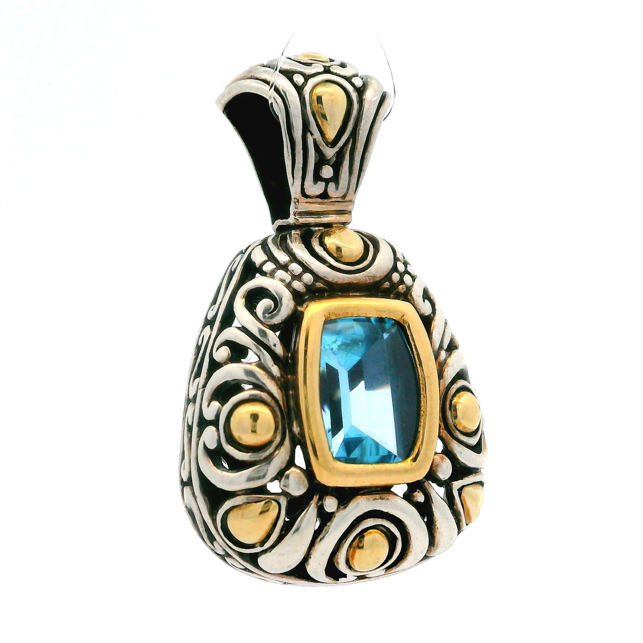 –Stone(s)–
(1) Natural Genuine Topaz - Buff Top - Bezel Set - Light Blue Color  - 10.12 x 7.59mm (approx.)
Material: Sterling Silver .925 - 18k Yellow Gold
Weight: 12.12 Grams
Overall Width: 23.17mm (0.91