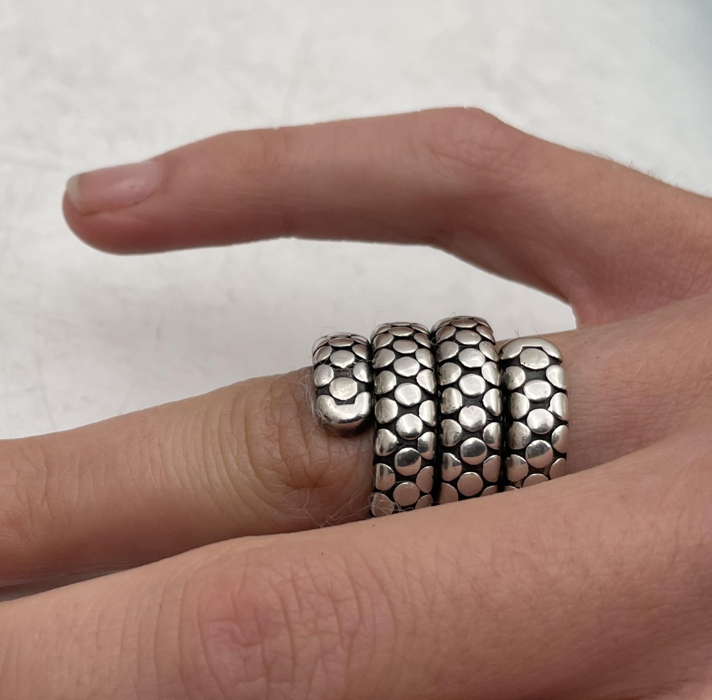 John Hardy sterling silver 3-coil dot flex wrap ring. It measures 7/8'' in expandable diameter by 7/8'' in height and bears hallmarks as shown. 

Please feel free to ask us any questions, and please see our other listings. 