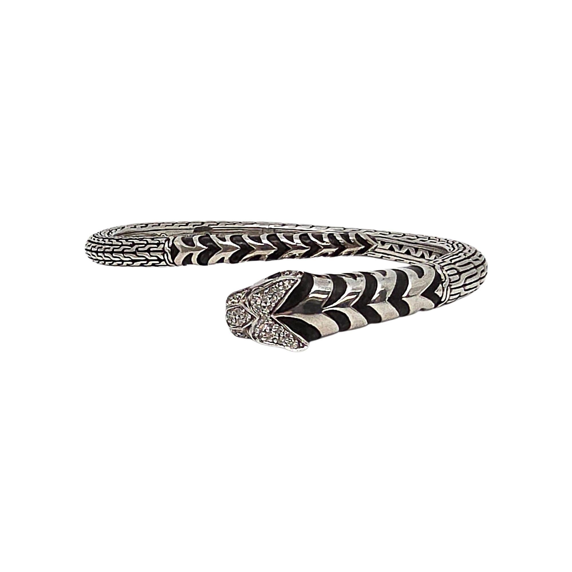 John Hardy sterling silver diamond Legends Macon Tiger bangle bracelet.

A beautiful bangle featuring a tiger face and tail with pave set diamonds on its head, light green stone eyes and black enamel stripes on a textured hinged bangle. Hinged for
