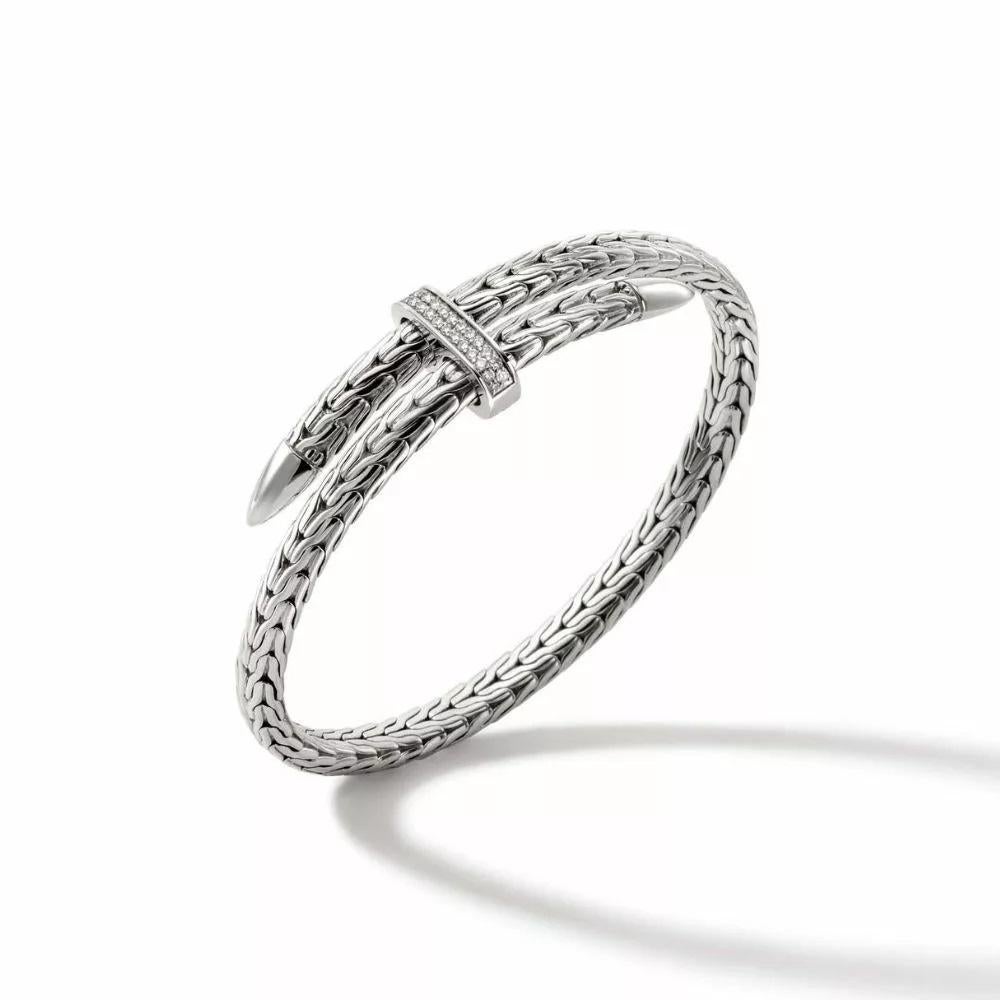 The John Hardy Spear Collection features modern bypass silhouettes and versatile designs. Crafted in sterling silver, this Flex Cuff Bracelet features a flexible design that effortlessly wraps around your wrist. A pavé diamond adorned lock keeps