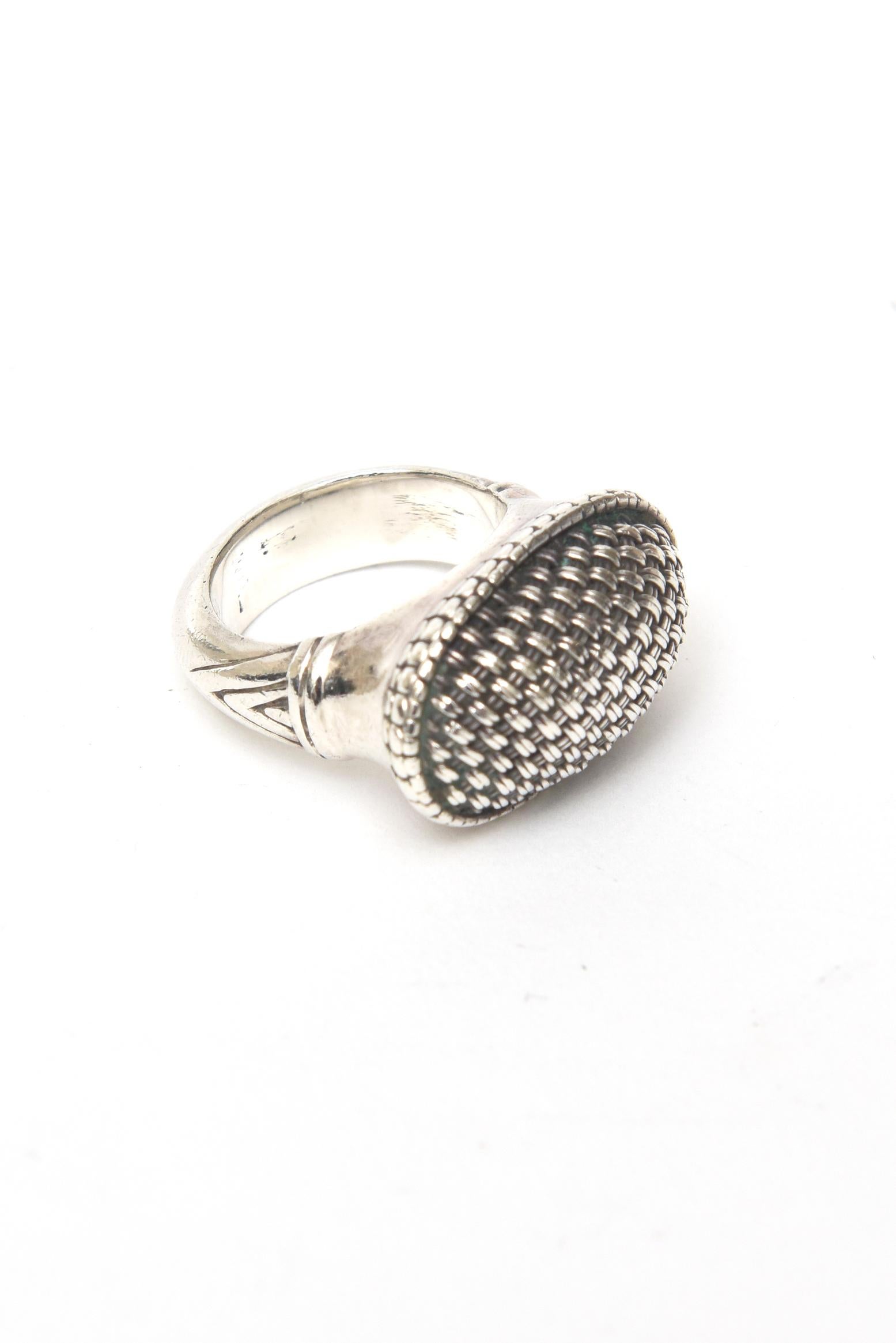 This beautiful John Hardy sterling silver hallmarked dome ring is one of his very early pieces that he created when he started his design work. It is hallmarked inside It has a beautiful criss cross of sterling silver and reads 925 with illegible