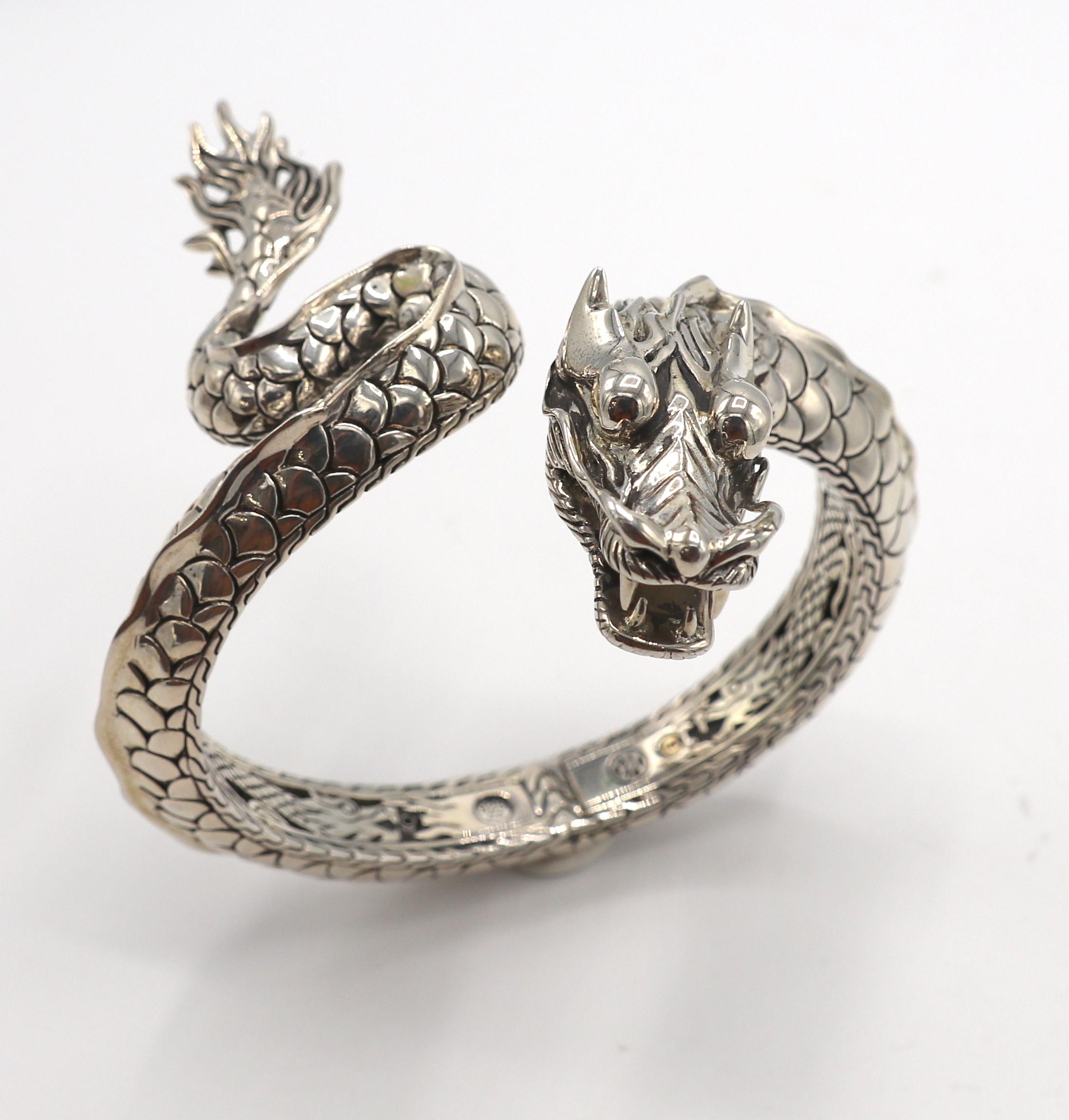 John Hardy Sterling Silver & Gold Dragon Hinged Bangle Bracelet 
Metal: Sterling silver & 18k yellow gold
Weight: 81.2 grams
Outer diameter: 76mm
Inner diameter: 62mm
Fits approx. 7