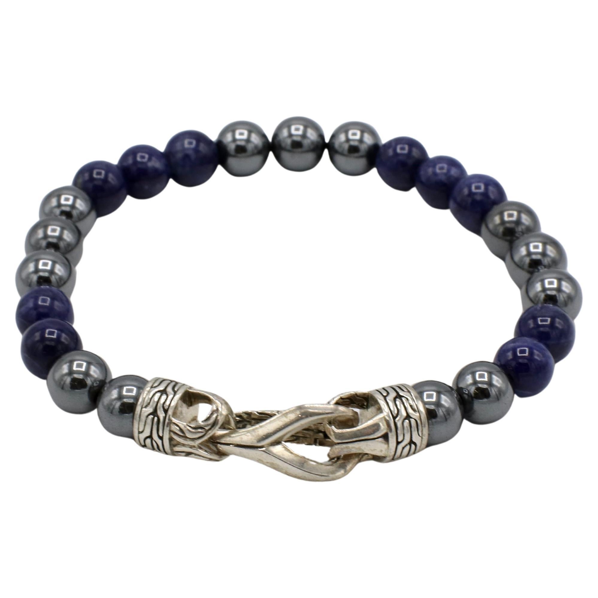 John Hardy Sterling Silver Hematite & Blue Sodalite Beaded Ball Bracelet 
Metal: Sterling silver 
Weight: 31.8 grams
Gemstones: Hematite and sodalite beads, 8mm
Length: 8.25 inches
Retail: $795 USD
NT F35000767
