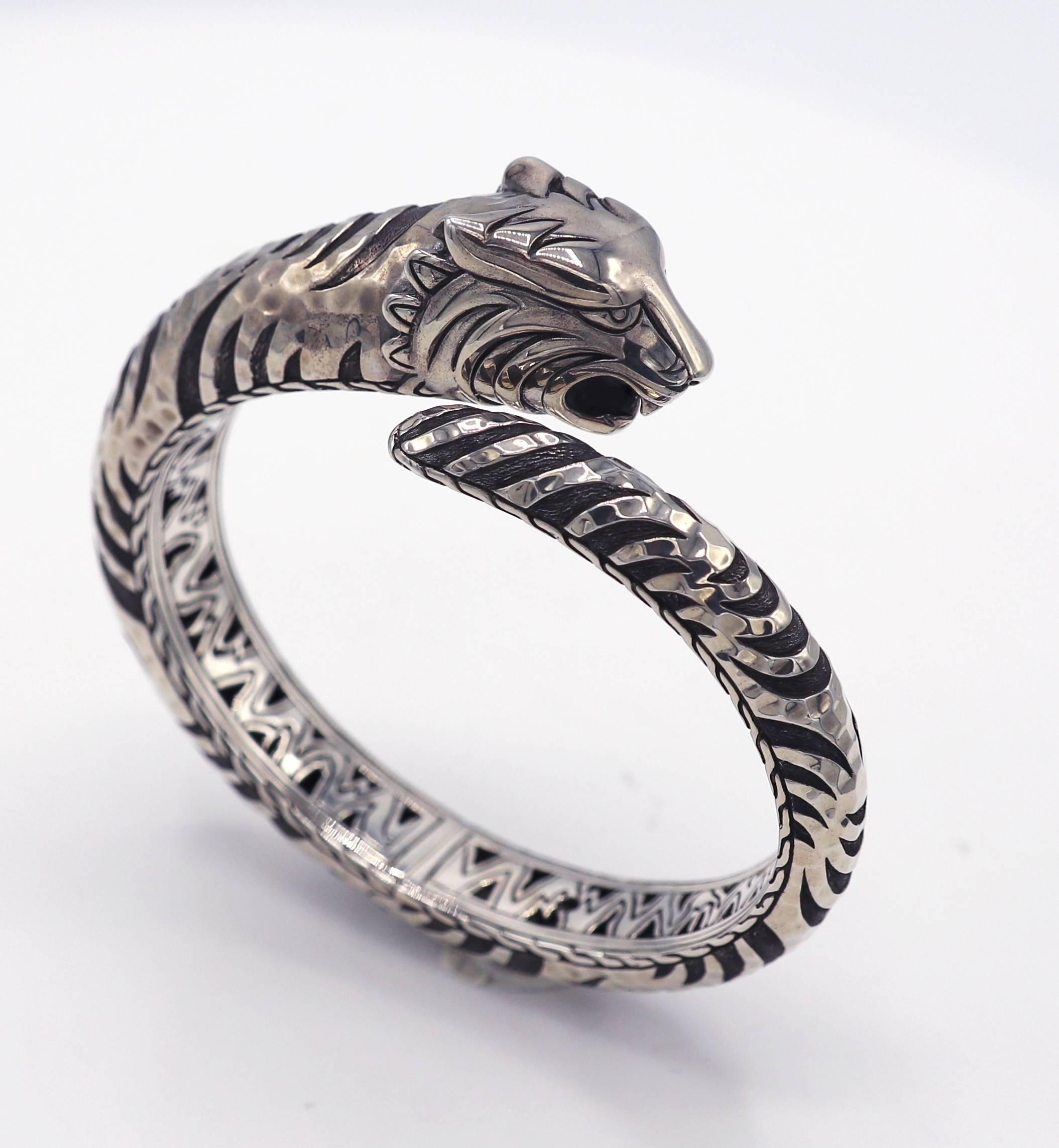 John Hardy Sterling Silver Legends Tiger Head Hinged Bangle Bracelet 
Metal: Sterling silver
Weight: 71 grams
Outer diameter: 75mm
Inner diameter: 62mm
Width: 8 - 16.5mm
Length: Fits approx. 7