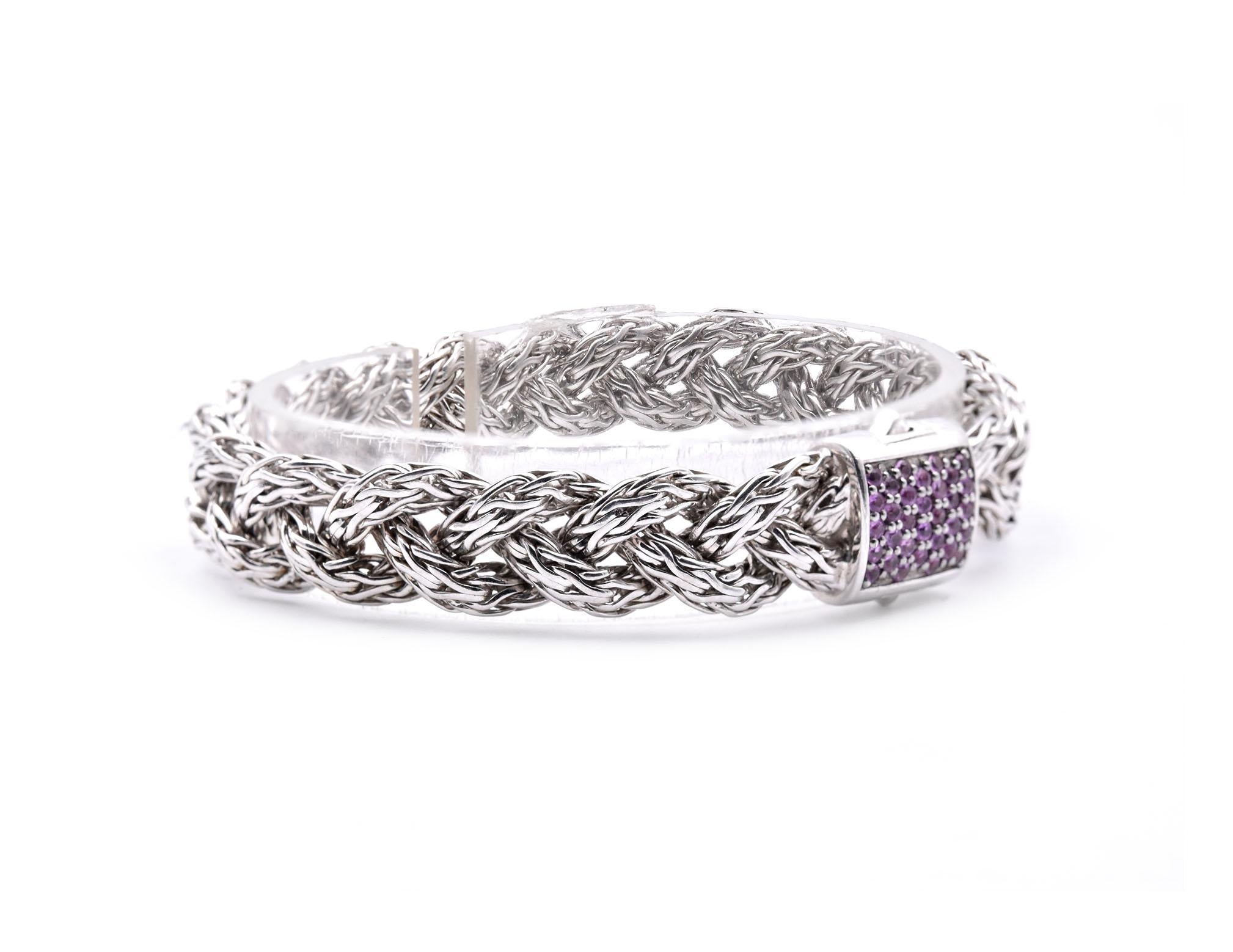 Designer: John Hardy
Material: sterling silver 
Pink Sapphire: 32 round brilliant cut = .64cttw
Dimensions: bracelet measures 7-inches
Weight: 32.71 grams
