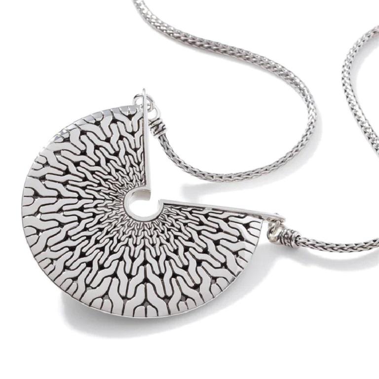 Inspired by the intricate details and symmetry of Mandalas, this necklace is sleek and chic.

- 925-Sterling Silver
- Chain Width: 2.5 MM
- Pendant Size: 42 MM X 50 MM
- Includes 16-18 Inch Chain
- Lobster Clasp
- NB900553X16-18