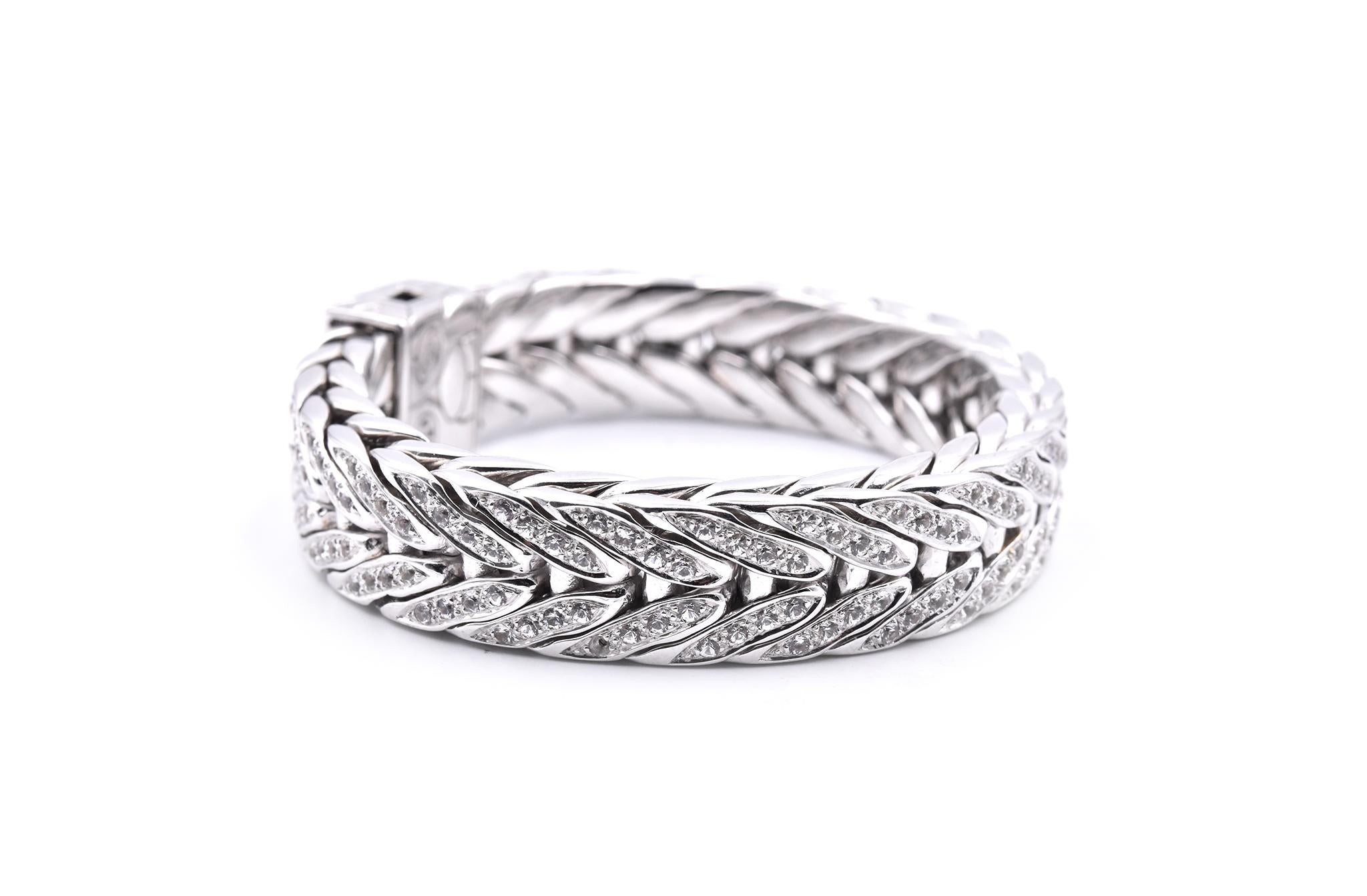 Designer: John Hardy
Material: sterling silver
Gemstone: white sapphire
Dimensions: bracelet is 8-inches long and it is 15.80mm wide
Weight: 176.52 grams
