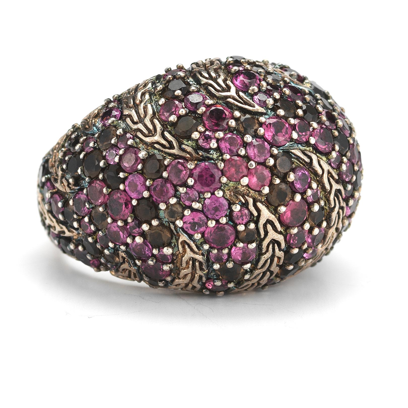 Oversized dome ring cast in sterling silver bears a braided stripe detail in dark pink cherry blossom colorway with light rhodolite and smoky quartz pave. Approx. setting diameter: 3/4 inch. Approx. band width: 1/2 inch at widest. Ring size 8.25

