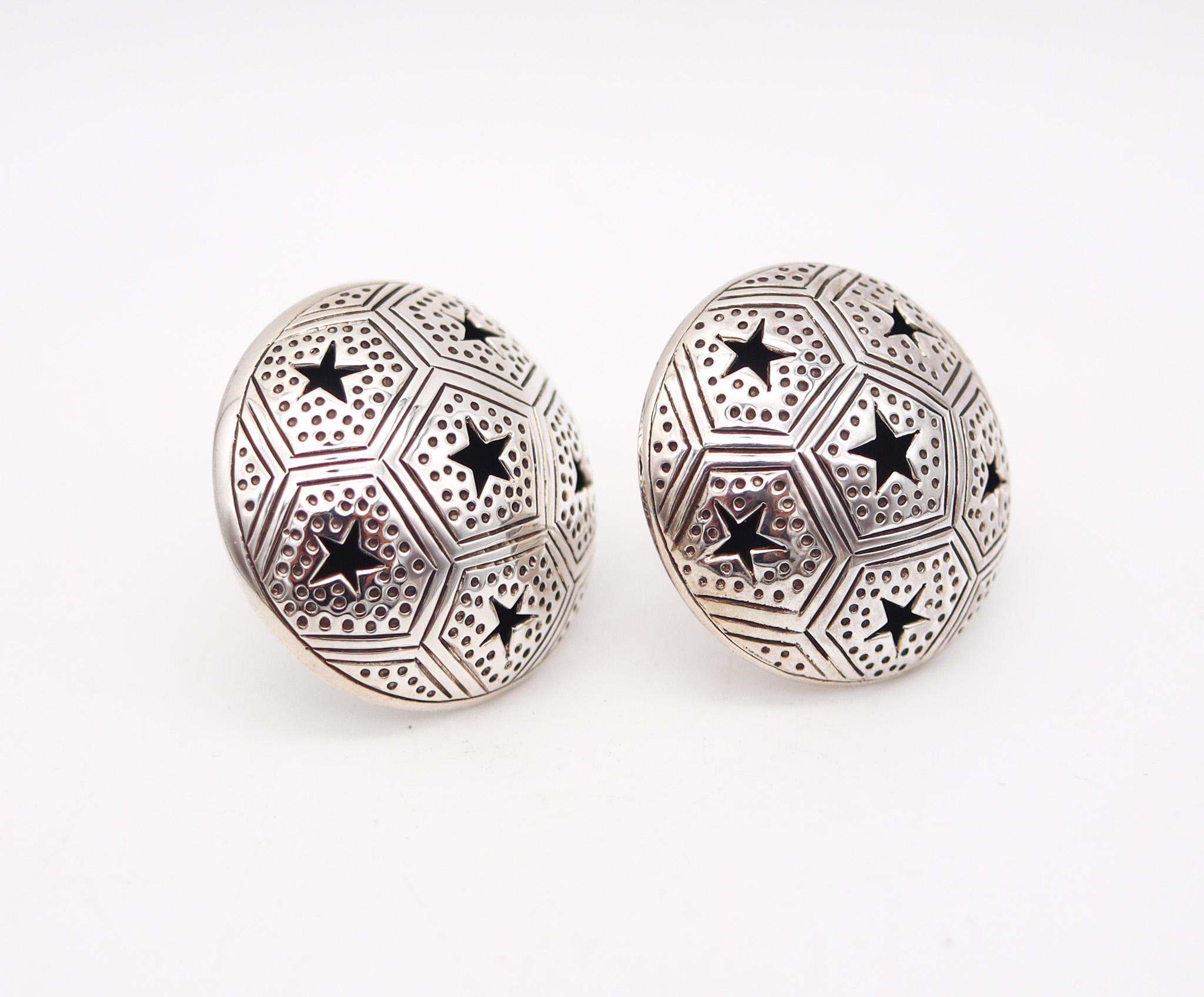 Pair of clips-on earrings designed by John Hardy.

Beautiful and unusual pair of clips-on earrings, created by the jeweler and designer Jonh Hardy. This pair has been crafted as a celestial dome with multiples stars in .925/.999 sterling silver with