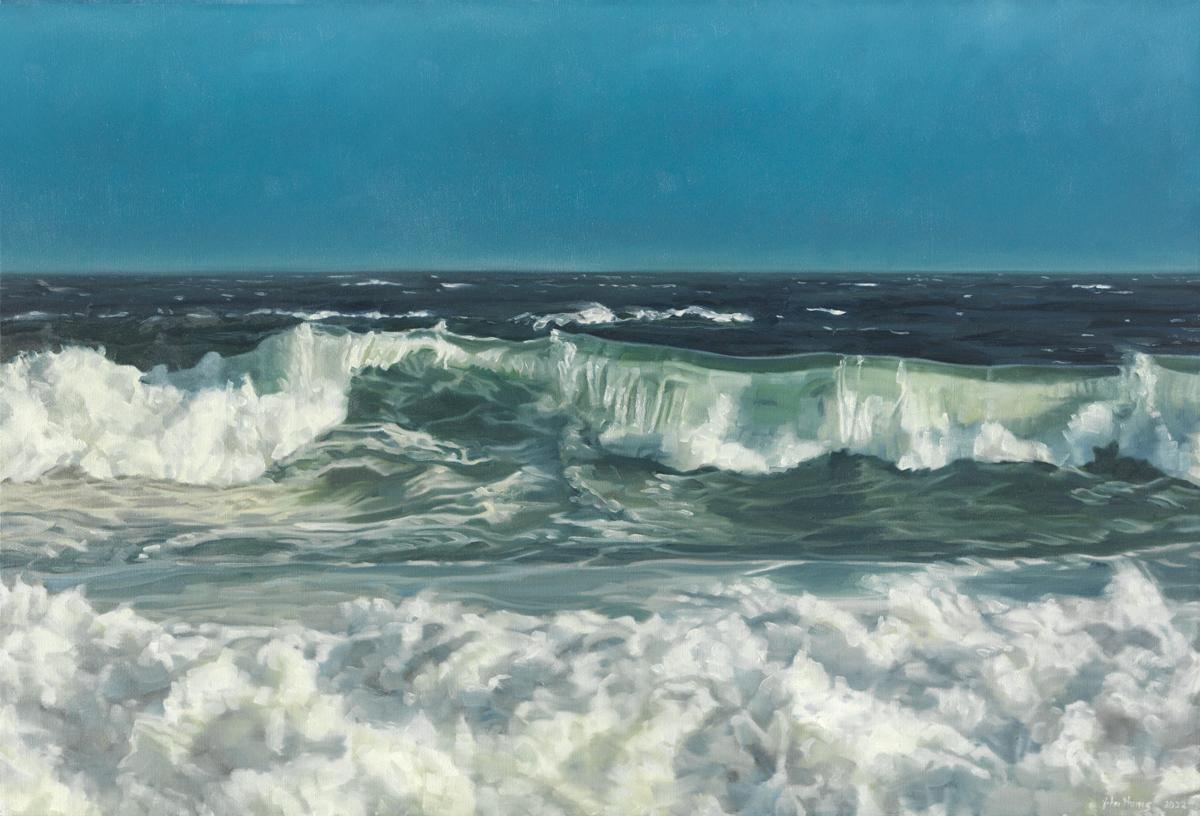 This limited edition seascape print by John Harris captures a highly detailed view of rolling ocean waves crashing near a shoreline under a clear blue sky. It features a mix of cool blue and sea green tones, highlighted by the white mist and foam of