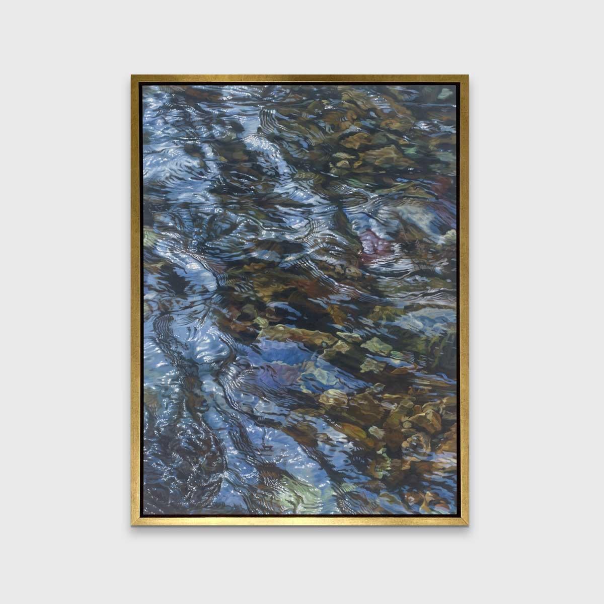 This realistic limited edition print captures a highly detailed, cropped, close-up view of water lightly rippling over rocks. The water reflects light above it to add dimension and depth to the piece. 

This Limited Edition giclee print is an