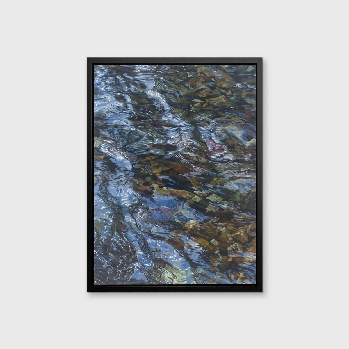 This realistic limited edition print captures a highly detailed, cropped, close-up view of water lightly rippling over rocks. The water reflects light above it to add dimension and depth to the piece. 

This Limited Edition giclee print is an