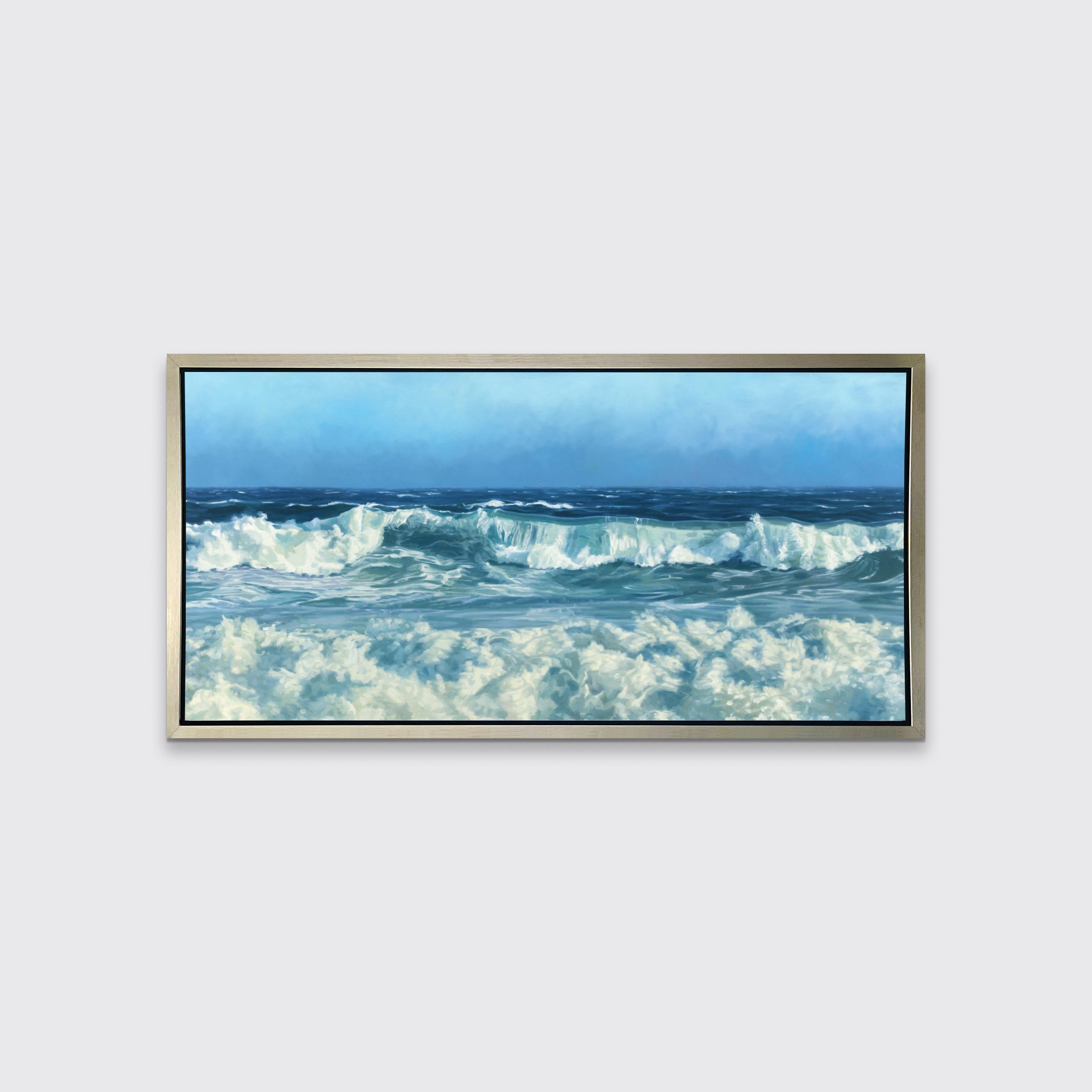 This coastal seascape limited edition print captures a cropped view of rolling waves below an ocean horizon line and a clear blue sky. Highly detailed and realistic, it balances the deep blues of the ocean with white foam and mist created by lightly