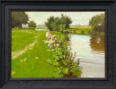 Vintage Man Fishing with Children Playing at a River Side in the English Countryside