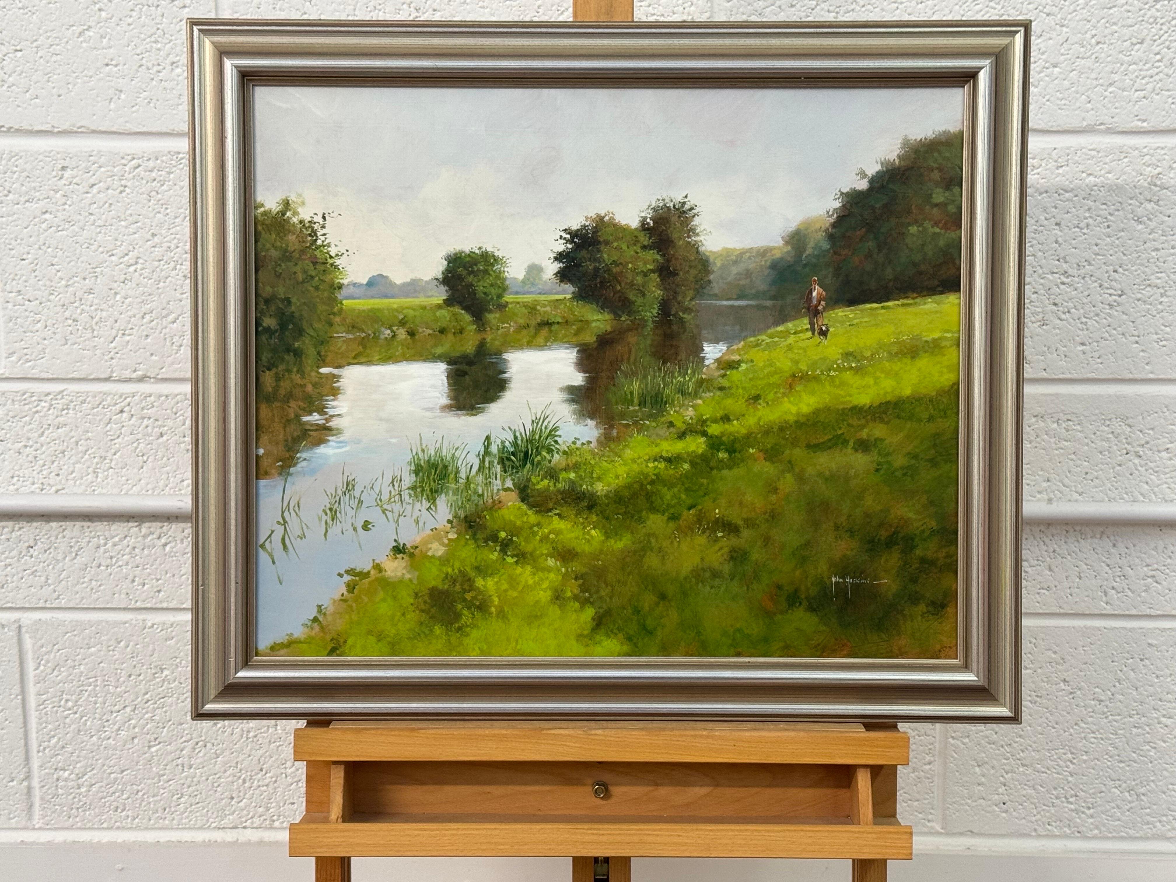 Hombre paseando al perro junto a un río en la exuberante campiña inglesa, por un artista británico del siglo XX 

El arte mide 20 x 16 pulgadas 
El marco mide 25 x 21 pulgadas 

John Haskins es un pintor británico conocido por sus representaciones