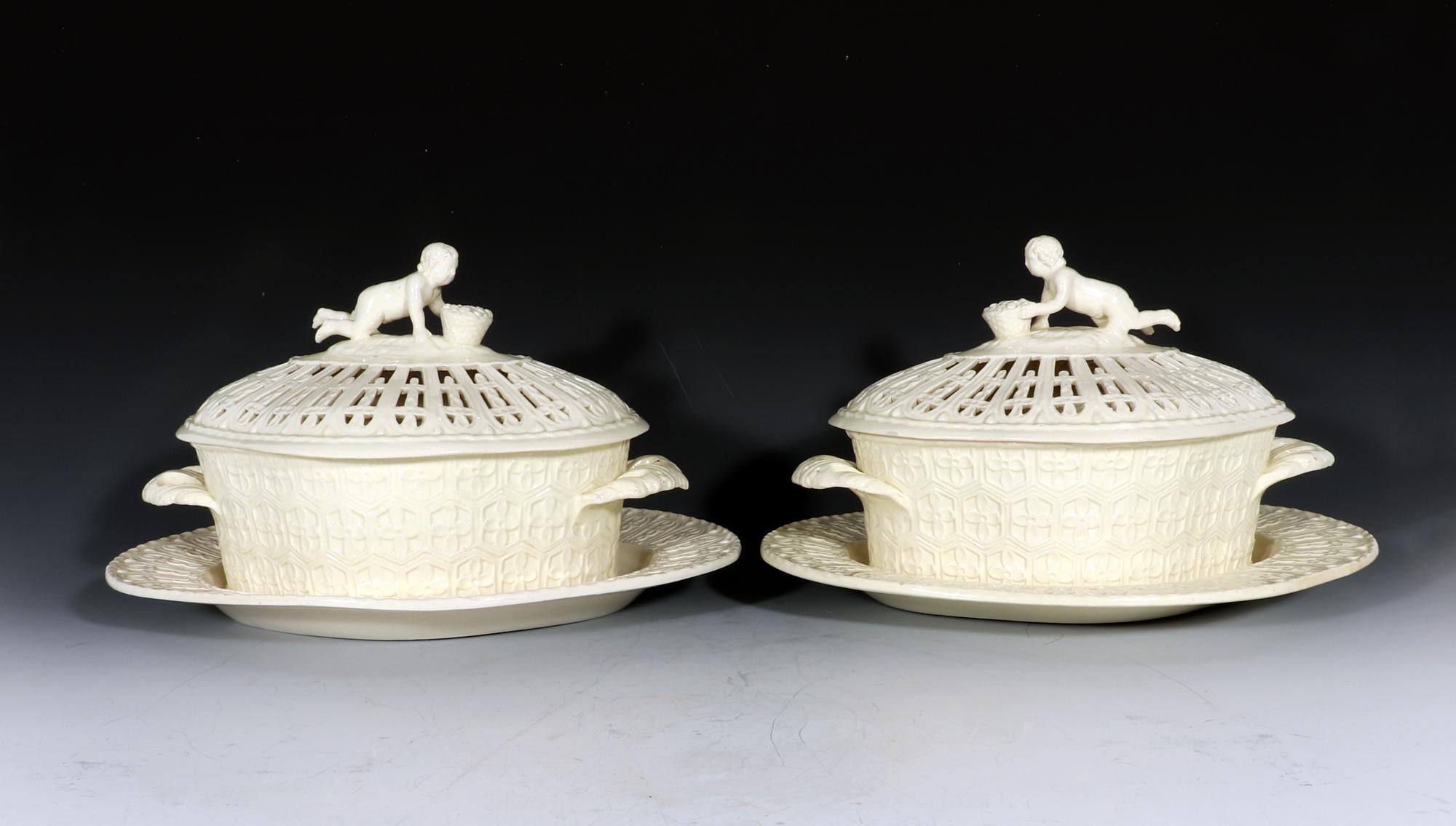 Creamware chestnut covered baskets and stands with figural finial,
Marked Heath,
circa 1800-1790

The shaped oval four-lobed basket has entwined double handles to each side with leaf terminals. The body is moulded with a series of stylized