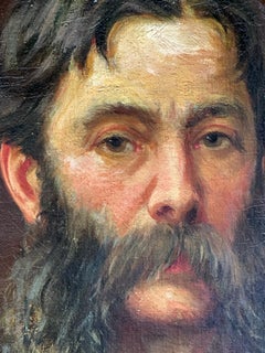 Early 20th century English self portrait of an artist holding his palette, brush