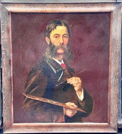 Early 20th century English self portrait of an artist holding his palette, brush