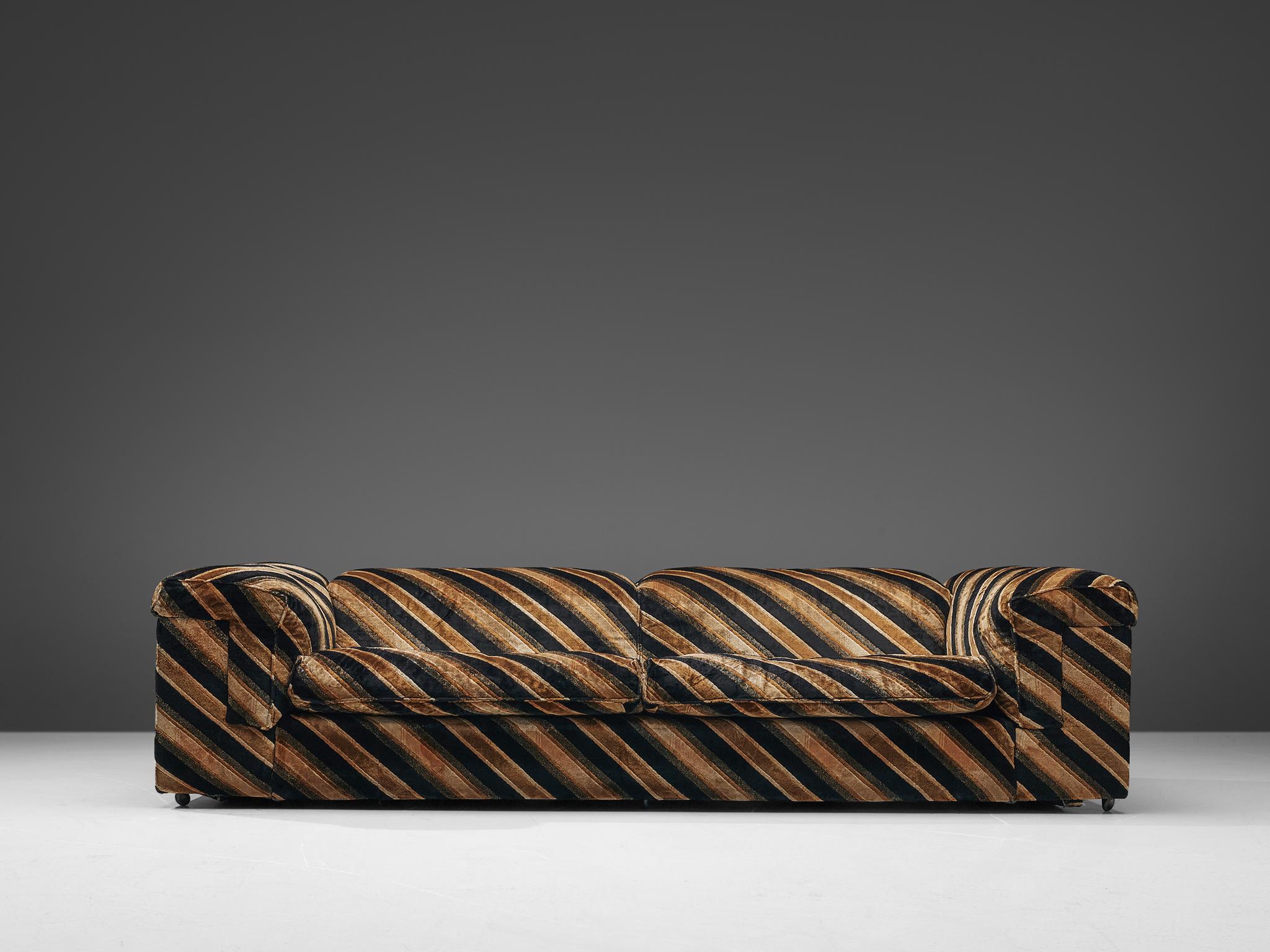 John Home for Howard Keith, 'Diplomat' sofa with ottoman, fabric and metal, United Kingdom, 1980s

Grand voluptuous sofa by Howard Keith for HK Furniture, a later version of the 1970s 'Diplomat' sofa. This sofa with a deep seat is a true delight