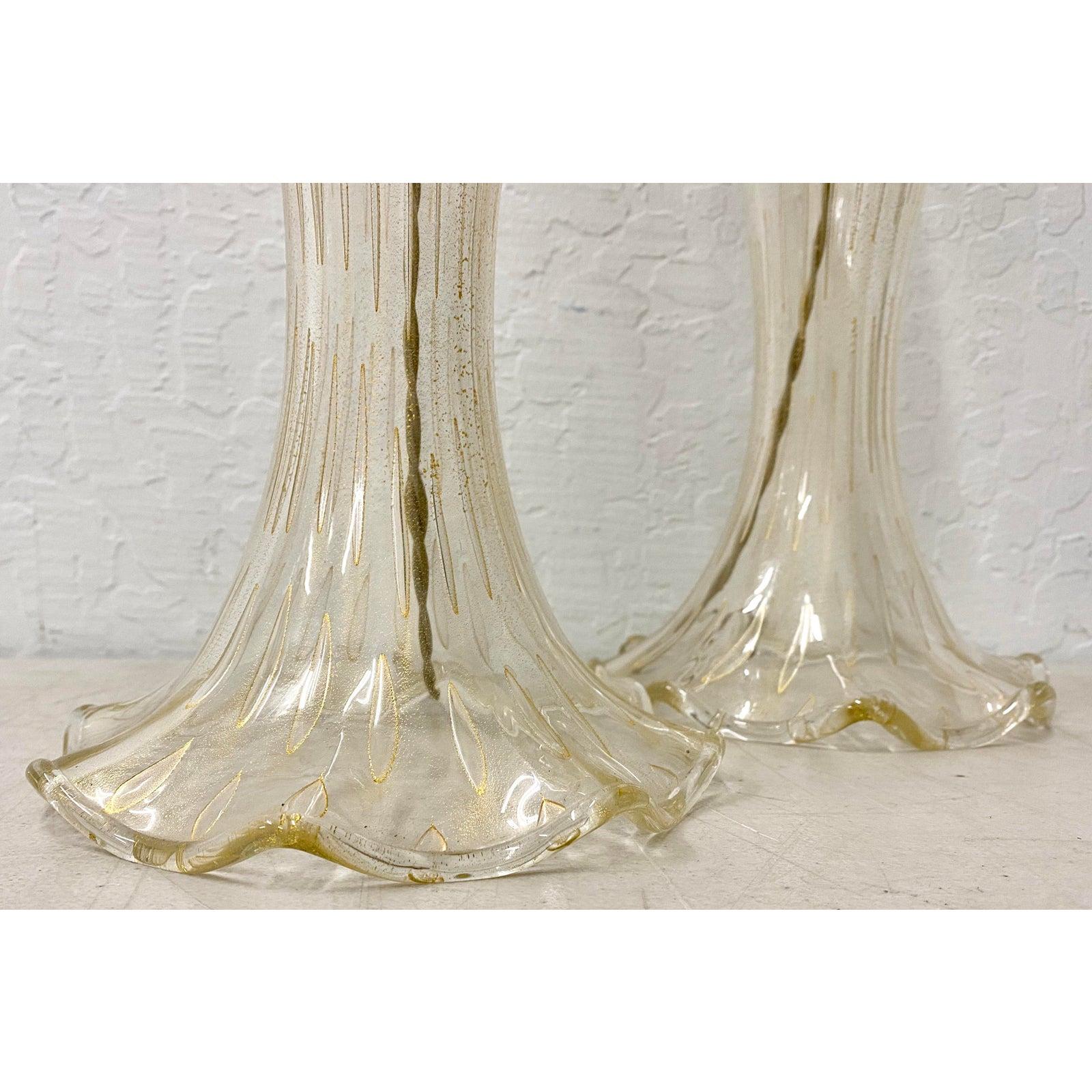 John Hutton for Donghia Murano hand blown glass table lamps

Sumptuous late 20th century hand blown table lamp with gold dust inclusions.

Elegant hollow body with a flared base. Each lamp has a hand blown matching finial.

The lamps are