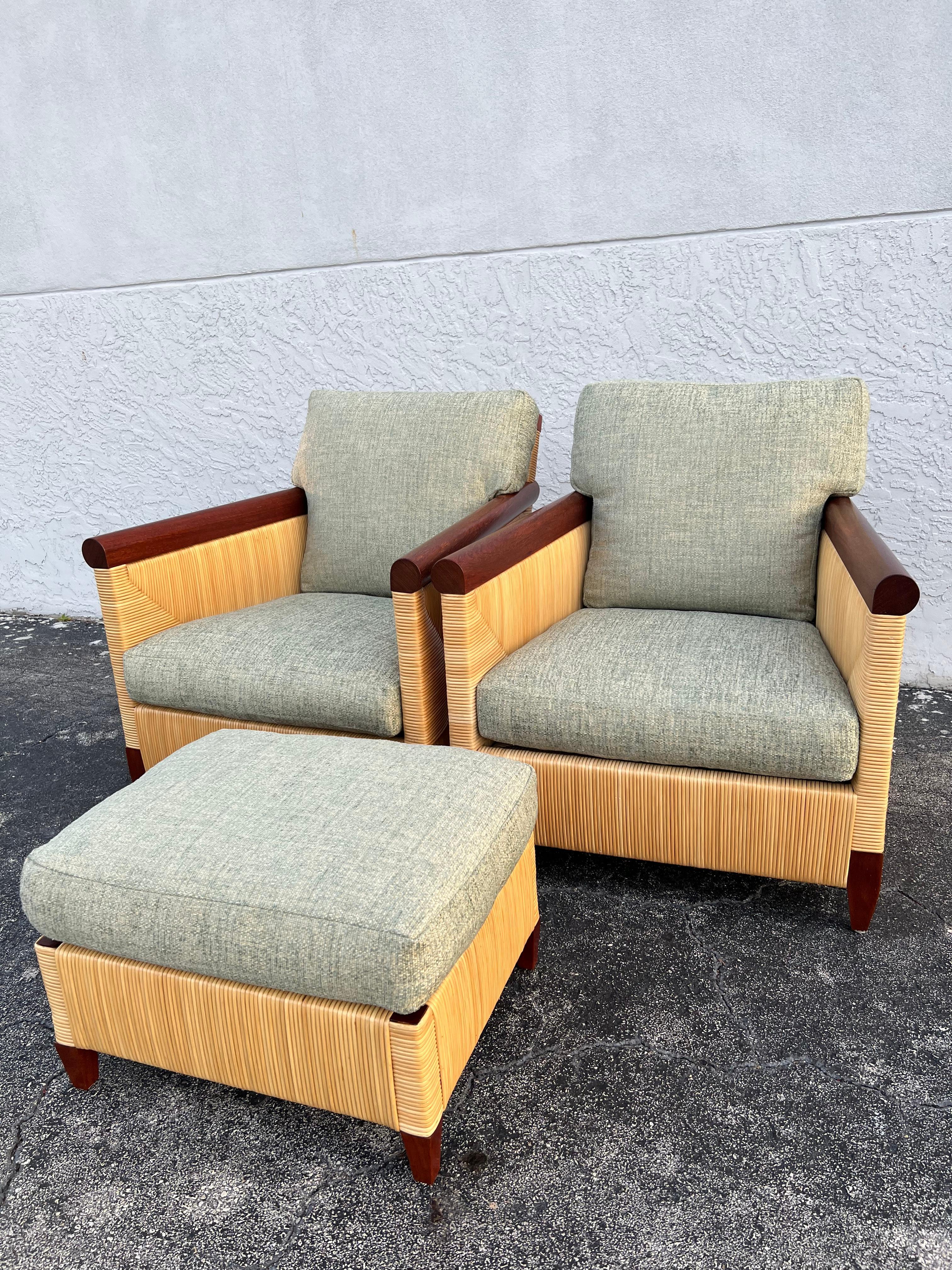 John Hutton for Donghia rattan lounge chairs and ottoman set. The set includes a pair of chairs and one ottoman. Reupholstered in a sage colored chenille blend. Slight variances in the finish of the rattan (please refer to the photos). Additional