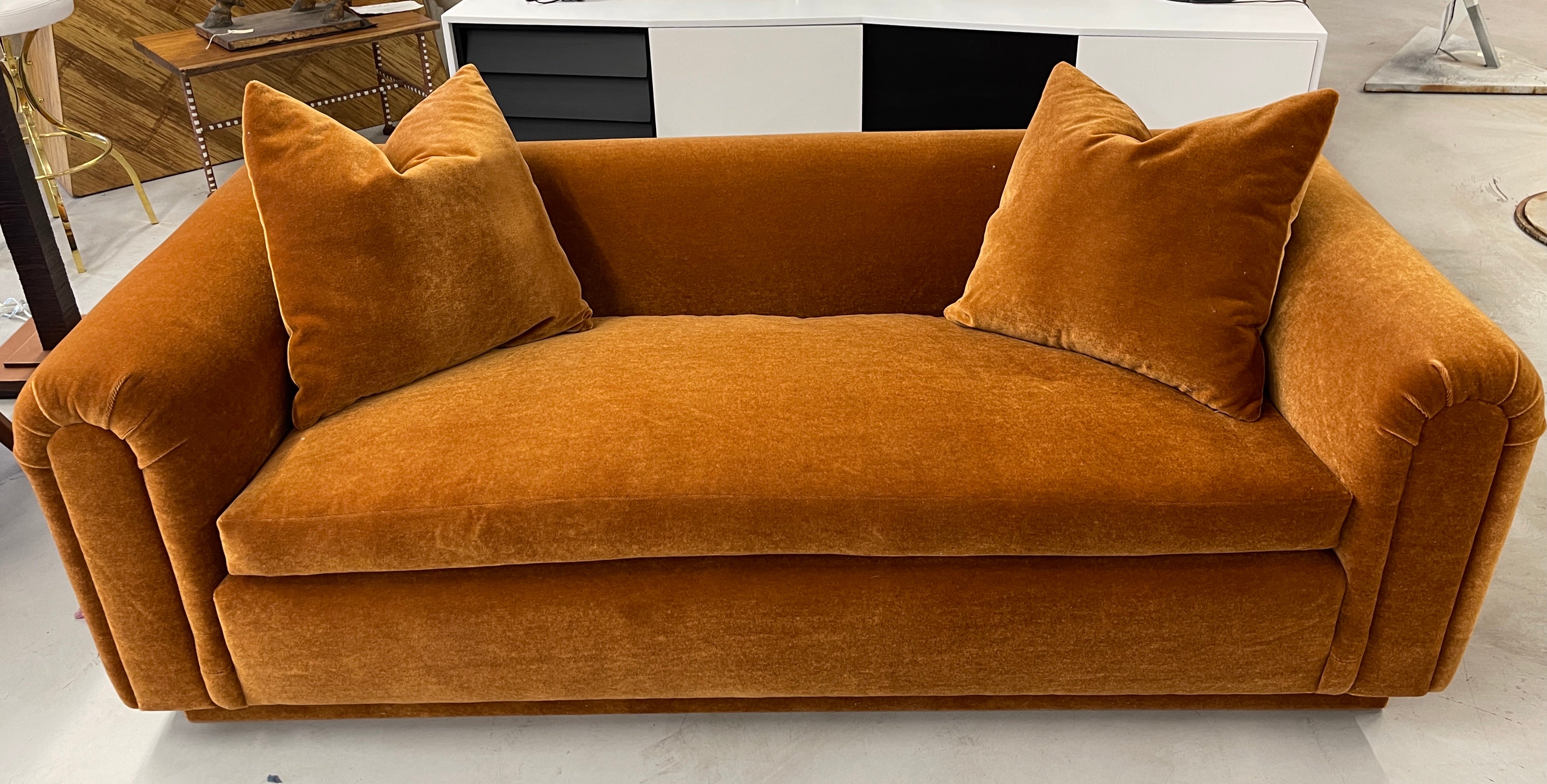 Beautiful reupholstered John Hutton designed sofa for Donghia. Out of a wonderful Palm Springs estate. The original fabric was a fuschia mohair and we’ve included a photo and of the label. Unfortunately the fabric was damaged and the label not