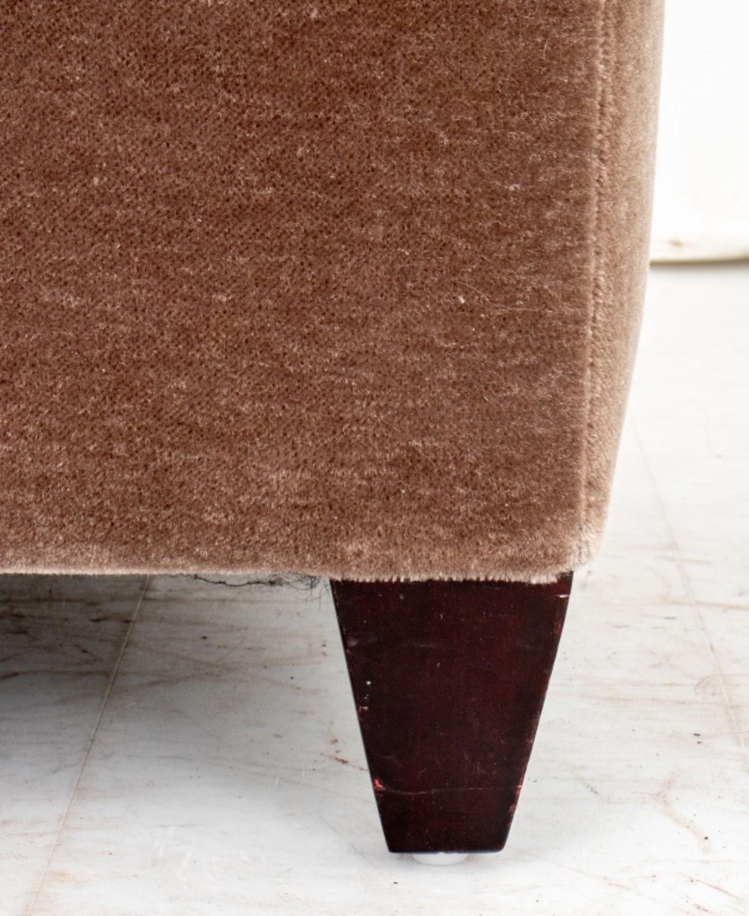 Sophisticated John Hutton for Donghia Ultrasuede Footstool

Add a touch of timeless elegance to your living space with this luxurious footstool, designed by renowned furniture designer John Hutton for Donghia. Crafted from sumptuous Ultrasuede