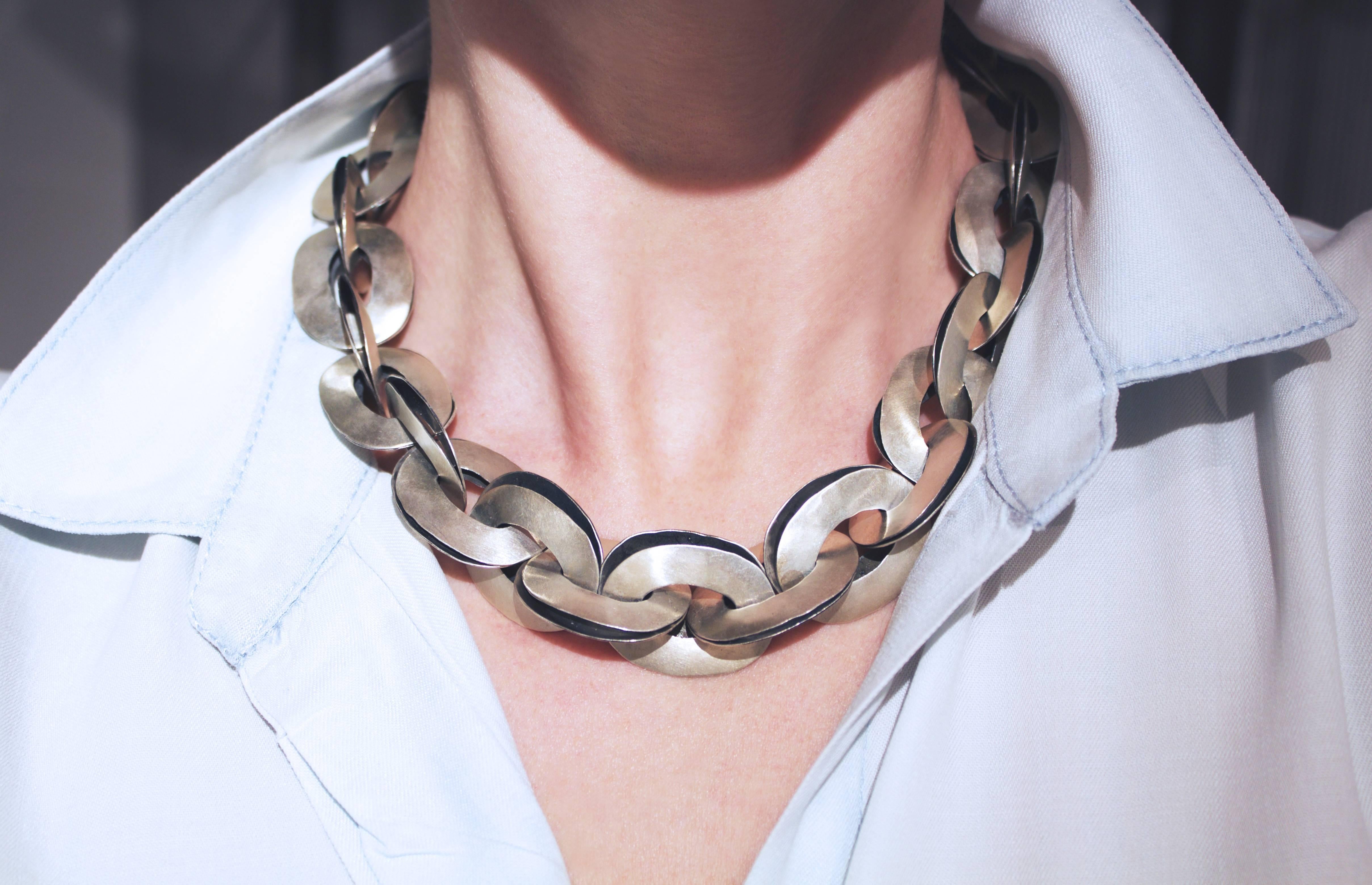 Double Link Chain Necklace handmade by renowned jewelry artist John Iversen, featuring stacked and interlocked double oval link elements designed with a hammered and matte-finished sterling silver exterior complemented by a hammered and