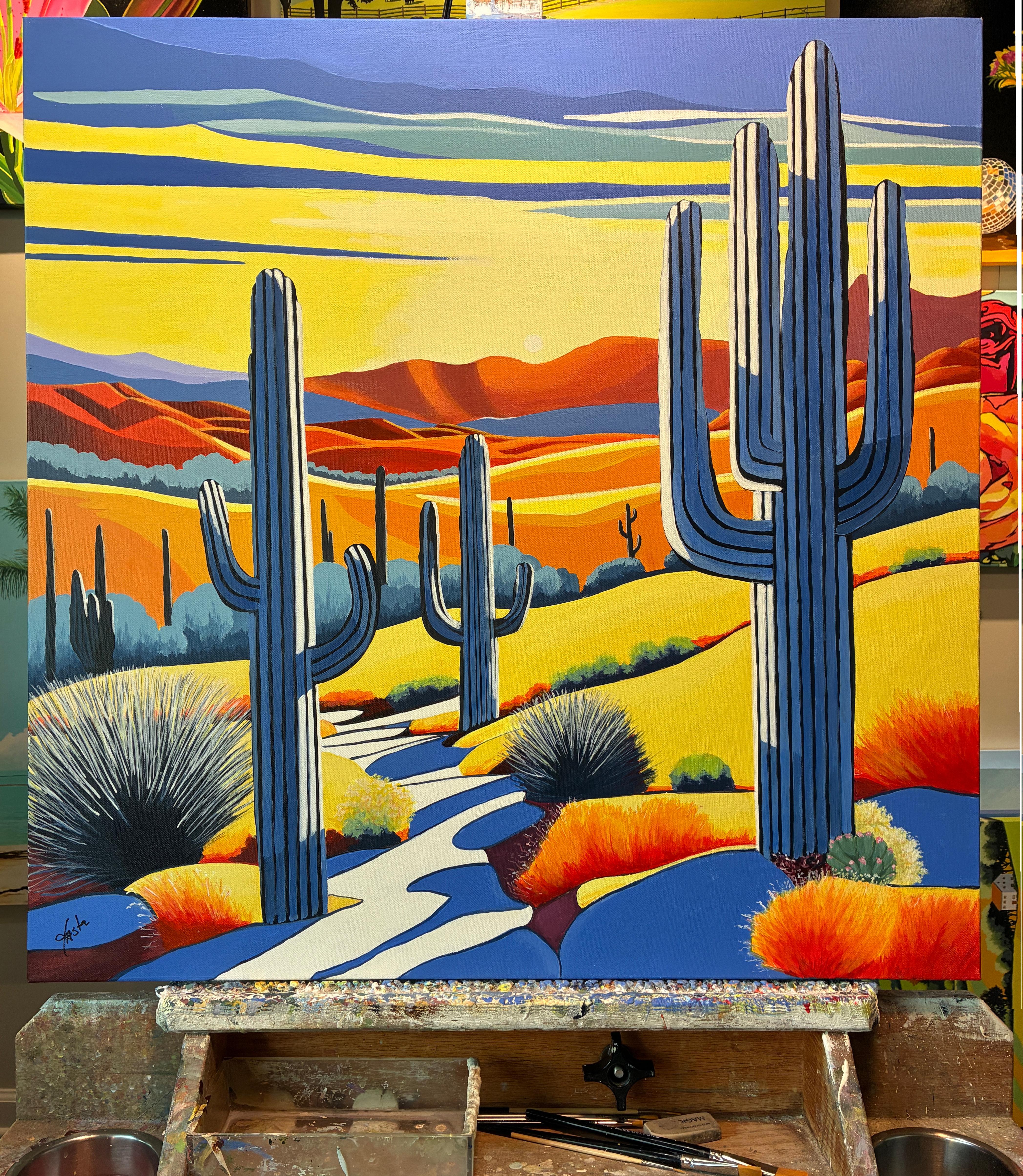 <p>Commentaires de l'artiste<br>De grands cactus saguaro parsèment un paysage vallonné du sud-ouest. Le soleil levant projette des ombres longues et spectaculaires qui s'étendent sur le terrain. Des rouges, des bleus et des jaunes éclatants