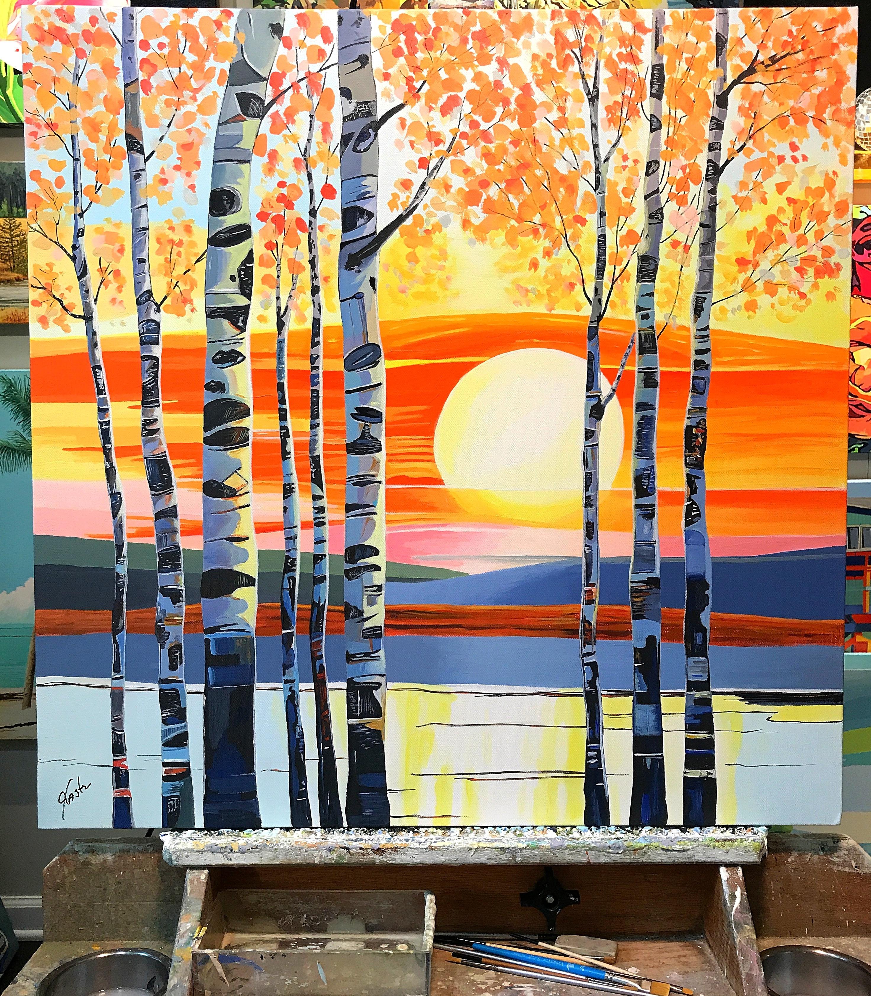 <p>Commenti dell'artista<br>In primo piano si ergono snelle betulle, le cui foglie dorate risplendono alla luce del sole. Il sole tramonta sullo sfondo, proiettando un vibrante bagliore arancione e giallo che si riflette sull'acqua immobile