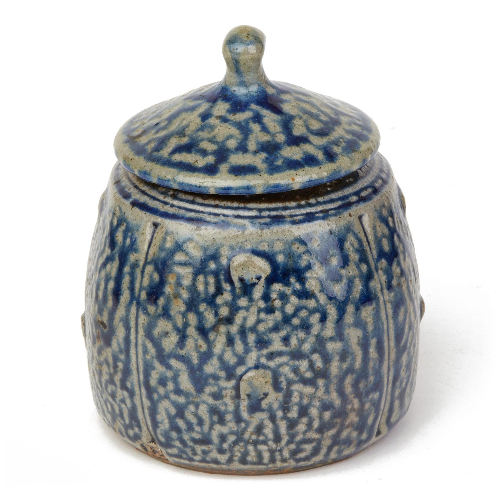 A fine vintage English blue salt glazed studio pottery lidded jar by renowned potter John Jelfs (English, b.1946) and dating from the 20th Century. This handcrafted jar is of rounded bulbous shape of rounded shape with a hat shaped cover with a