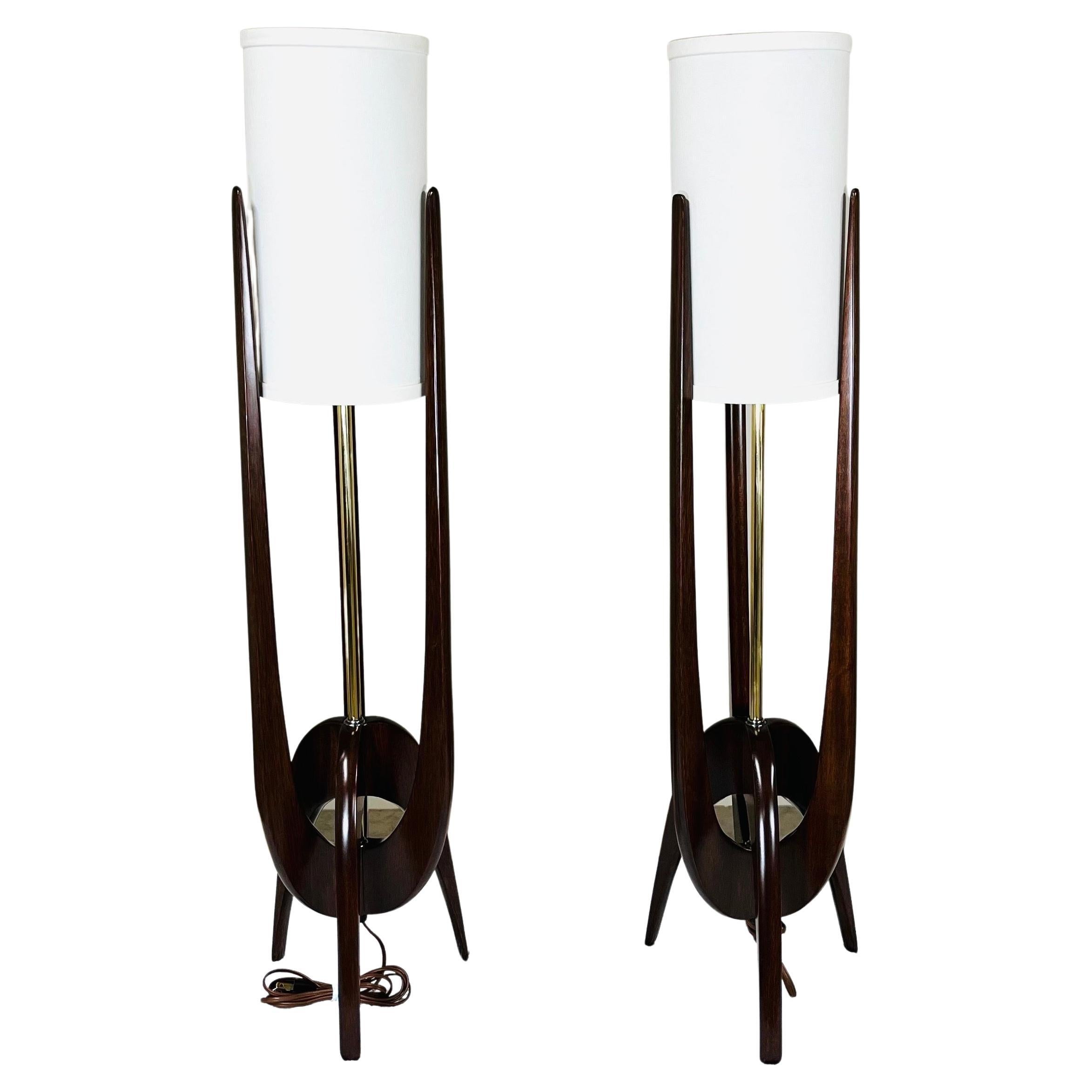 A stunning pair of sculptural mahogany trident table lamps attributed to John Keal and produced by Modeline circa 1960 having newly refinished frames with new shades and fresh wiring. 
In perfect condition and fully functional. These are time