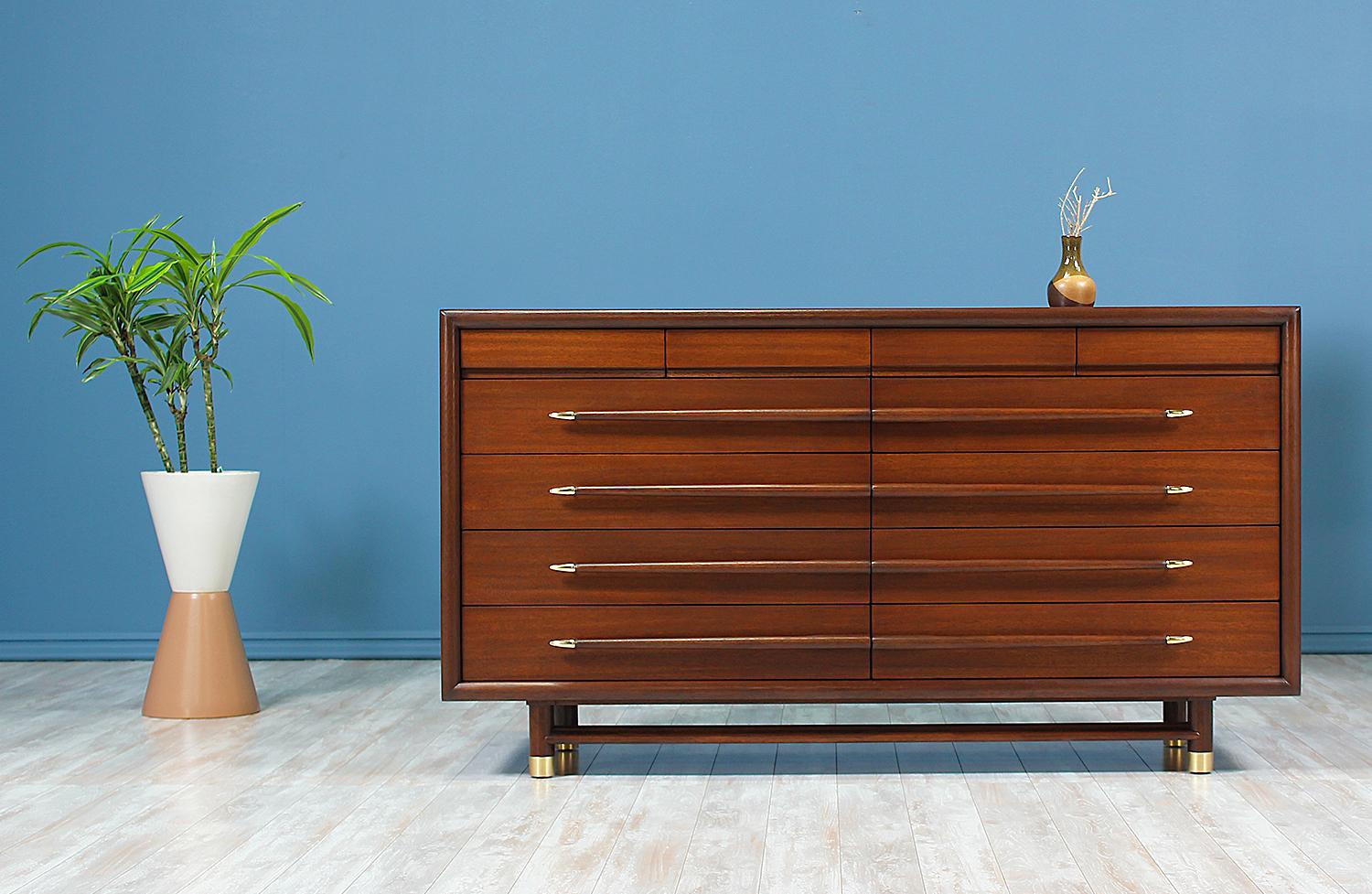 Designer: by John Keal
Manufacturer: Brown Saltman
Country of origin: United States
Date of manufacture: 1950-1959
Materials: Walnut-stained mahogany wood, brass accents
Period style: Mid-Century Modern

Condition: Excellent
Extra