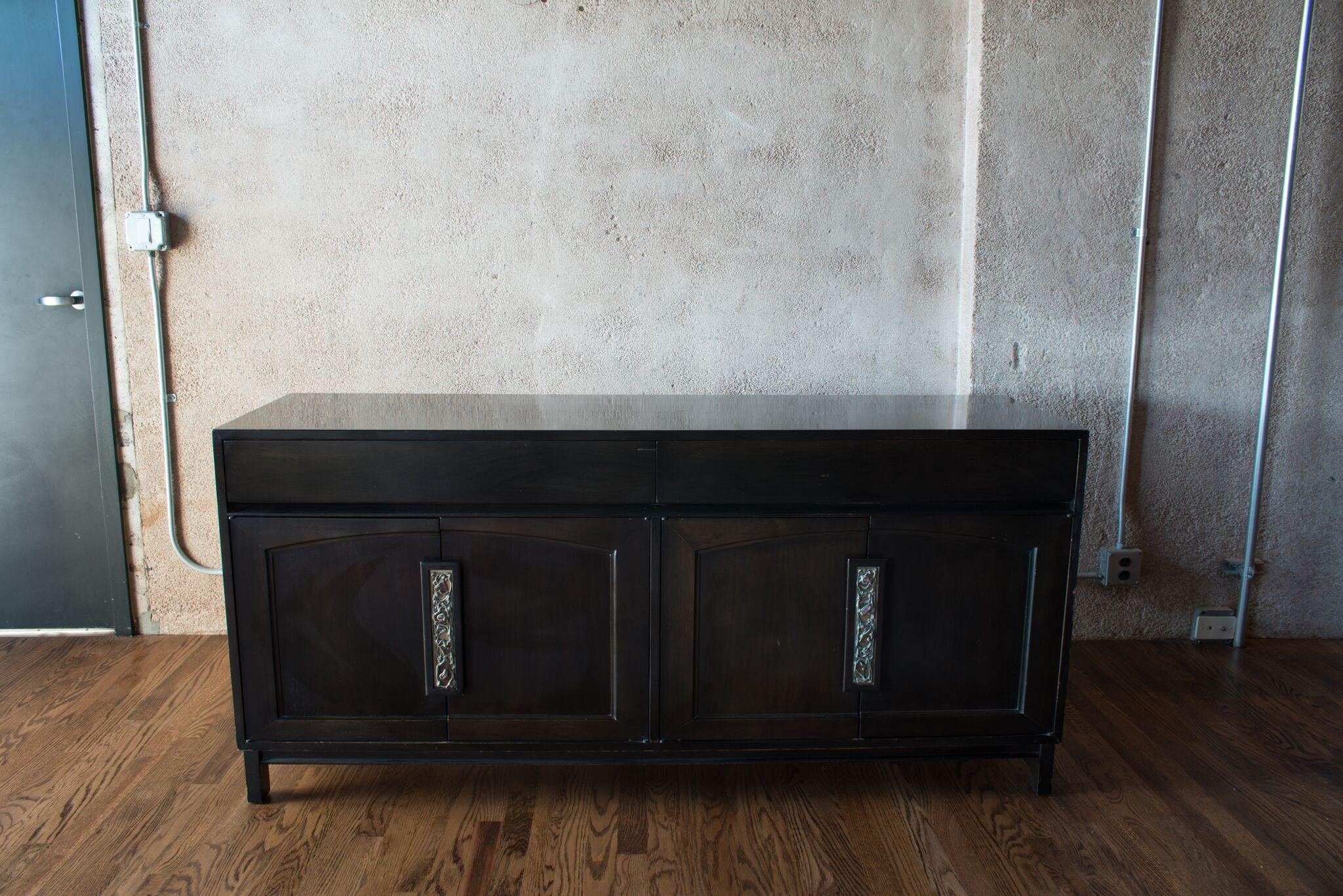 Credenza or buffet designed by John Keal for Brown Saltman. 

A piece from a rare series of case pieces designed by John Keal and produced by Brown Saltman, circa 1958. Stout, expertly made walnut case construction with great movement and color.