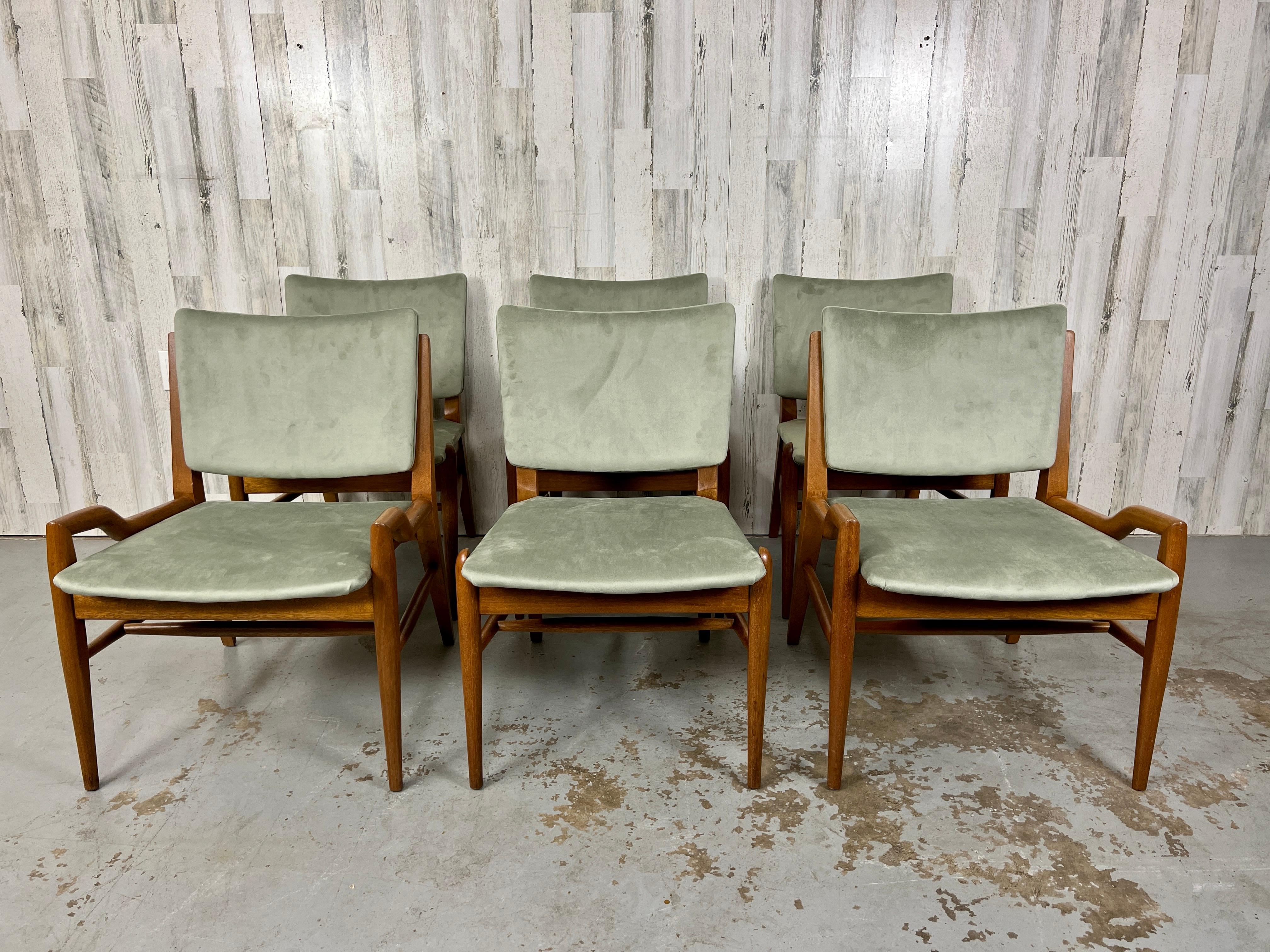 Classic Mid Century Design by John Keal for Brown Saltman furniture.
Newly refinished in a satin light walnut with sage green upholstery

Arm chairs measure: 24 1/2 deep x 22 1/4 wide x 30 1/4 high x seat height 16 1/4.