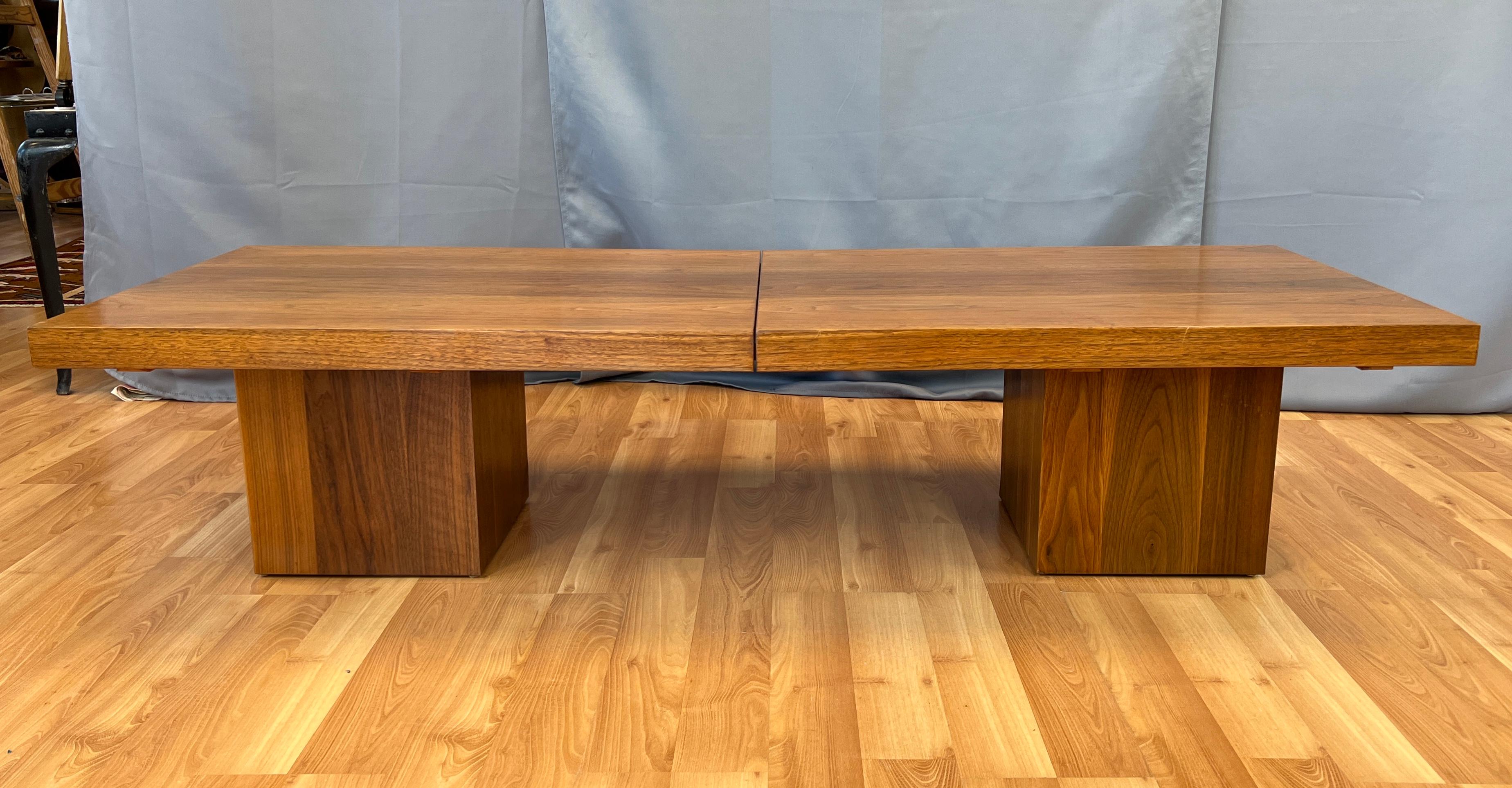 Wonderful John Keal design for Brown Saltman, circa 1950s./ Walnut top sitting on two walnut cube bases, when you pull or separate the top haves, it reveals Black formica. This expands the area you can entertain with, and the formica is a hardier