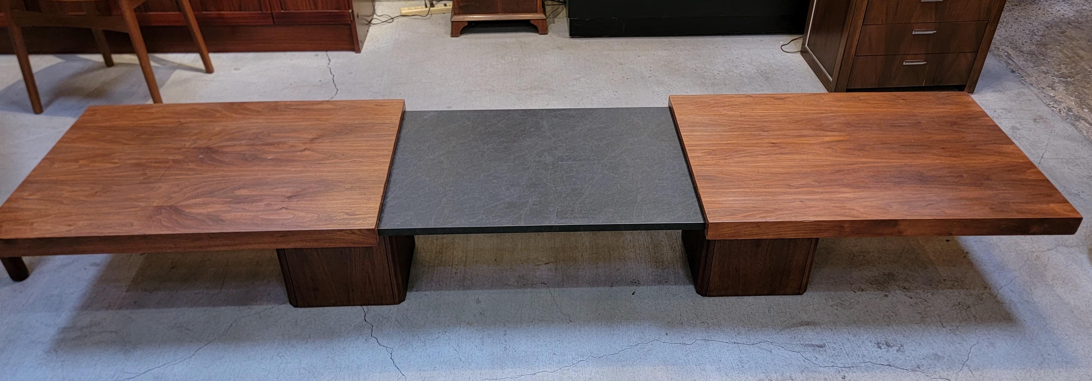 A Mid-Century Modern expanding coffee table designed by John Keal for Brown Saltman of California. Table adjusts between 66 inches to 95 inches in width. Good original condition.