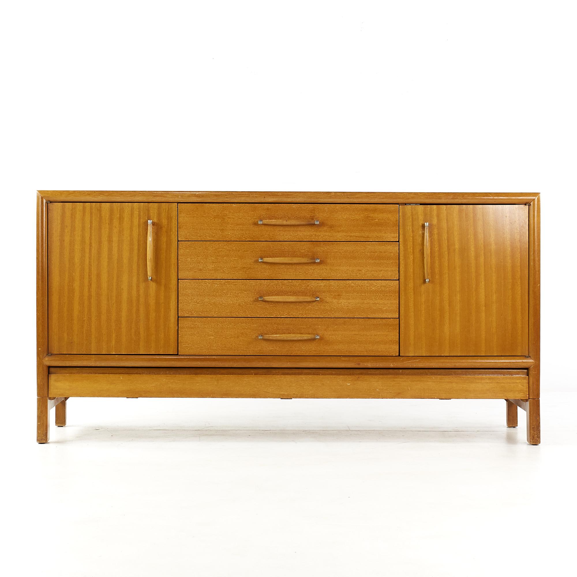 John Keal for Brown Saltman Mid Century Bleached Mahogany Credenza

This credenza measures: 66 wide x 20 deep x 33 inches high

All pieces of furniture can be had in what we call restored vintage condition. That means the piece is restored upon