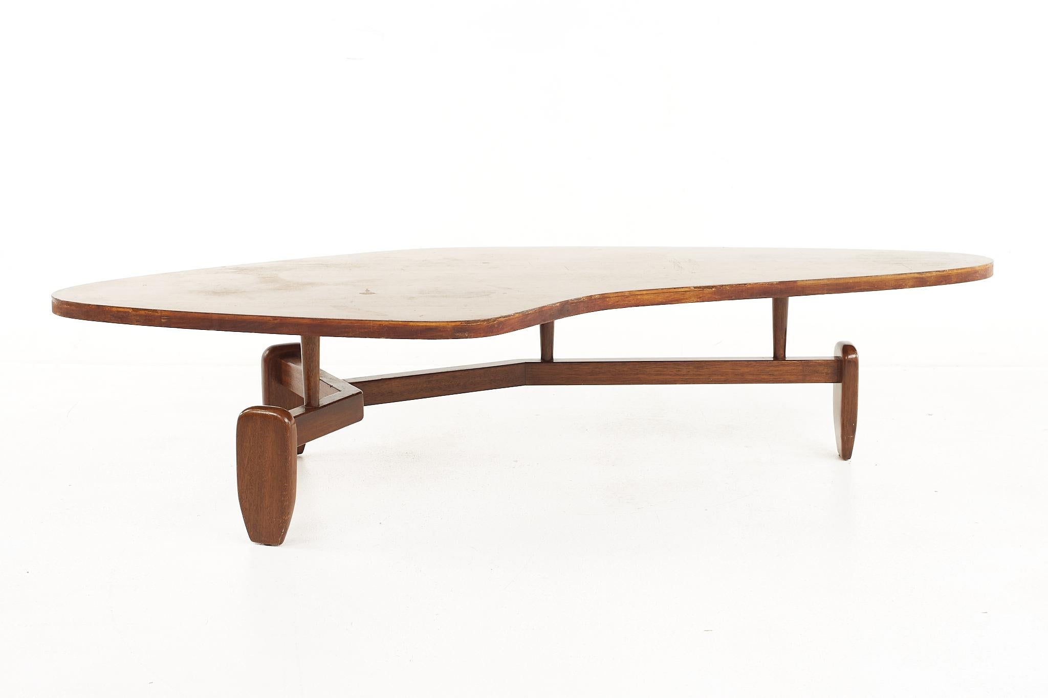 John Keal for brown saltman mid century bleached mahogany outrigger coffee table.

This table measures: 66 wide x 29 deep x 14.25 inches high.

All pieces of furniture can be had in what we call restored vintage condition. That means the piece