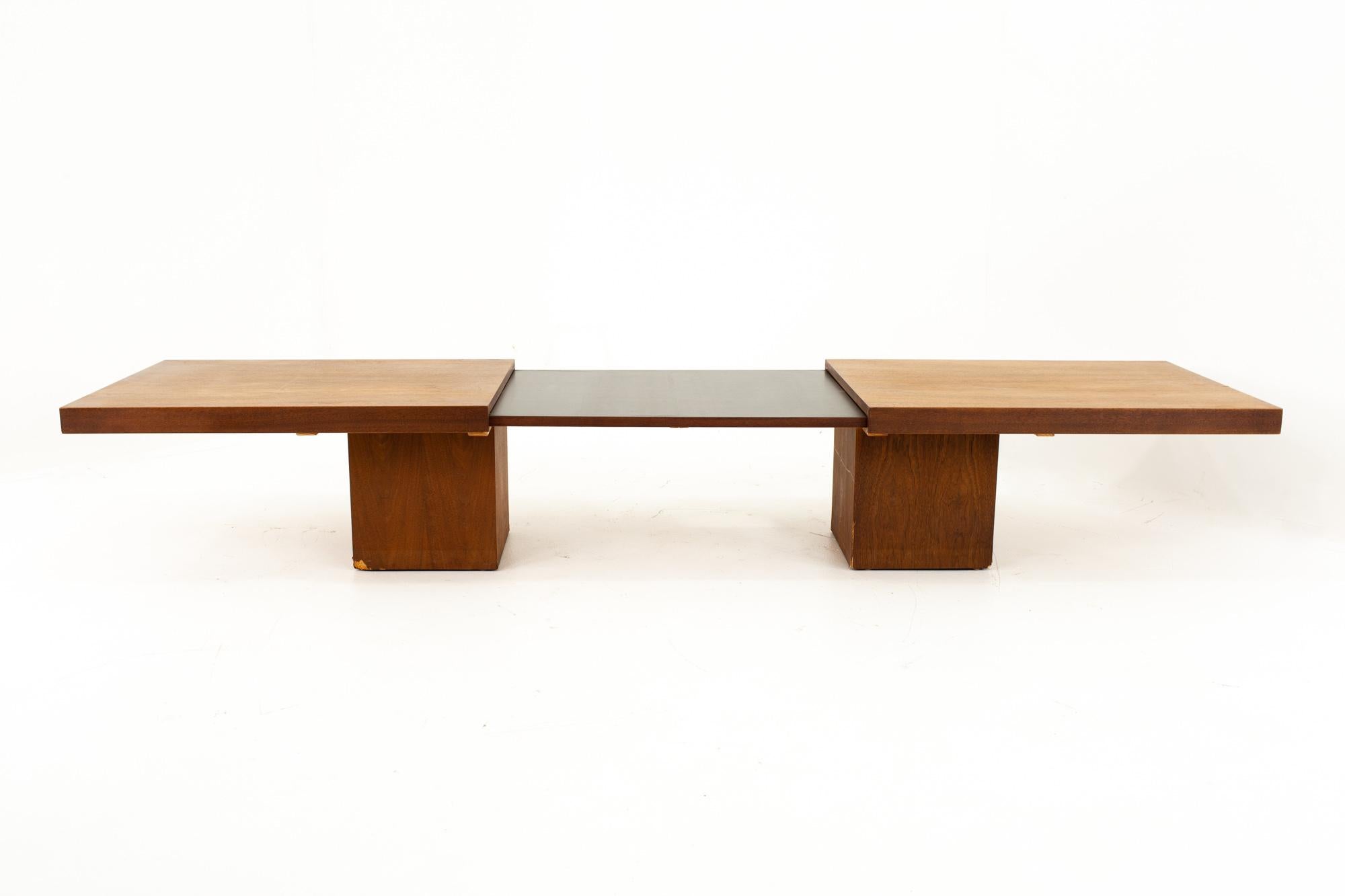 John Keal for Brown Saltman Mid Century expanding coffee table
Table measures: 66 wide x 24 deep x 15 high 
When expanded table measures: 95.5 wide x 24 deep x 15 high

This price includes getting this piece in what we call restored vintage