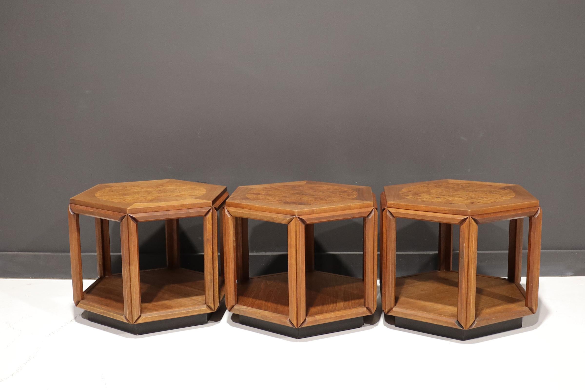 Set of three hexagonal shape side tables design by John Keal for Brown Saltman in the 1970’s.
Constructed of walnut with a burl wood circle on the top.
In beautiful vintage condition with minor wear consistent with age. Arrange them in multiple