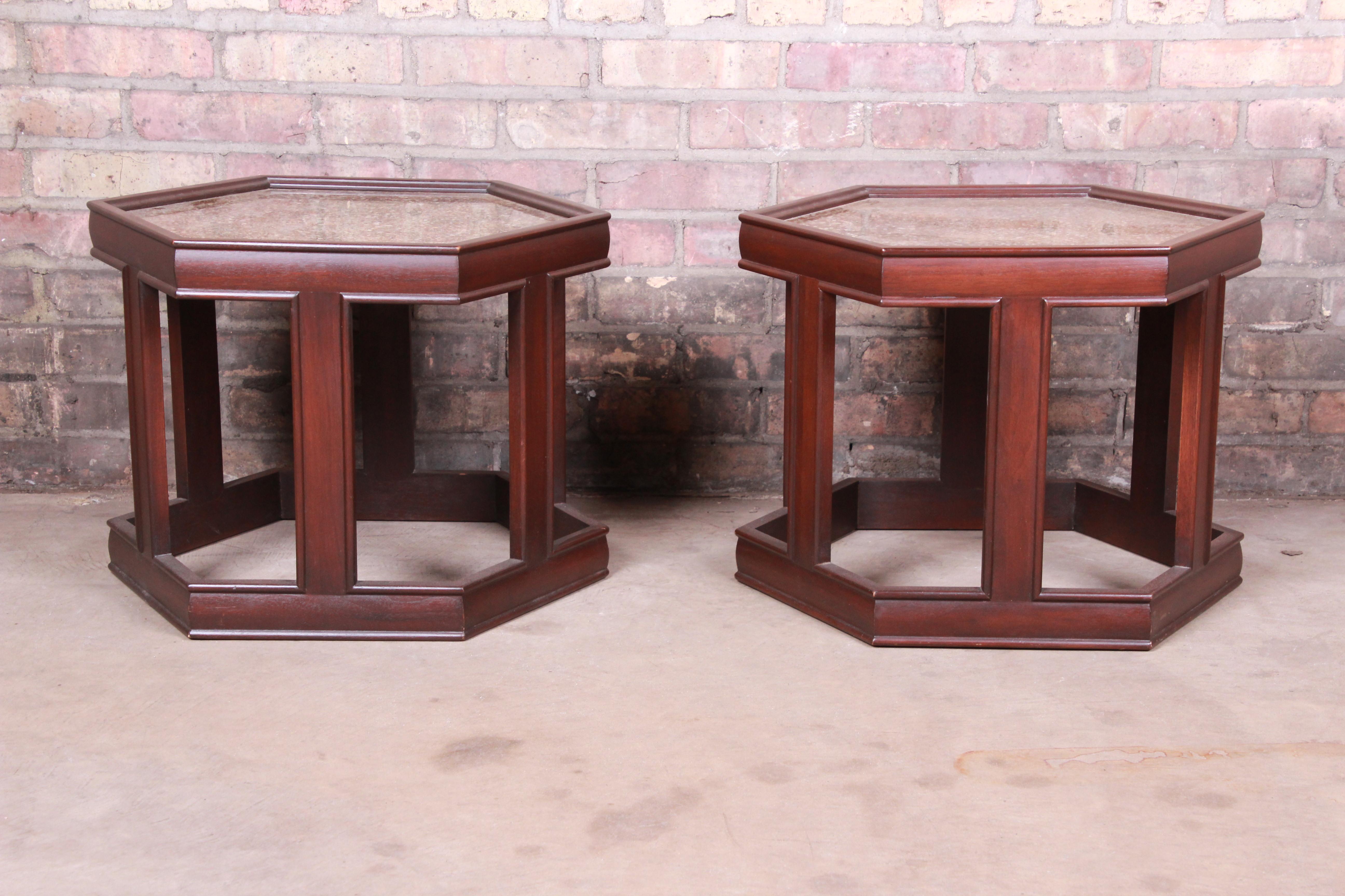 An exceptional pair of Mid-Century Modern hexagonal side tables

By John Keal for Brown-Saltman

USA, 1960s

Dark walnut, with a brilliant reverse-painted and textured glass top in gold tones.

Measures: 21