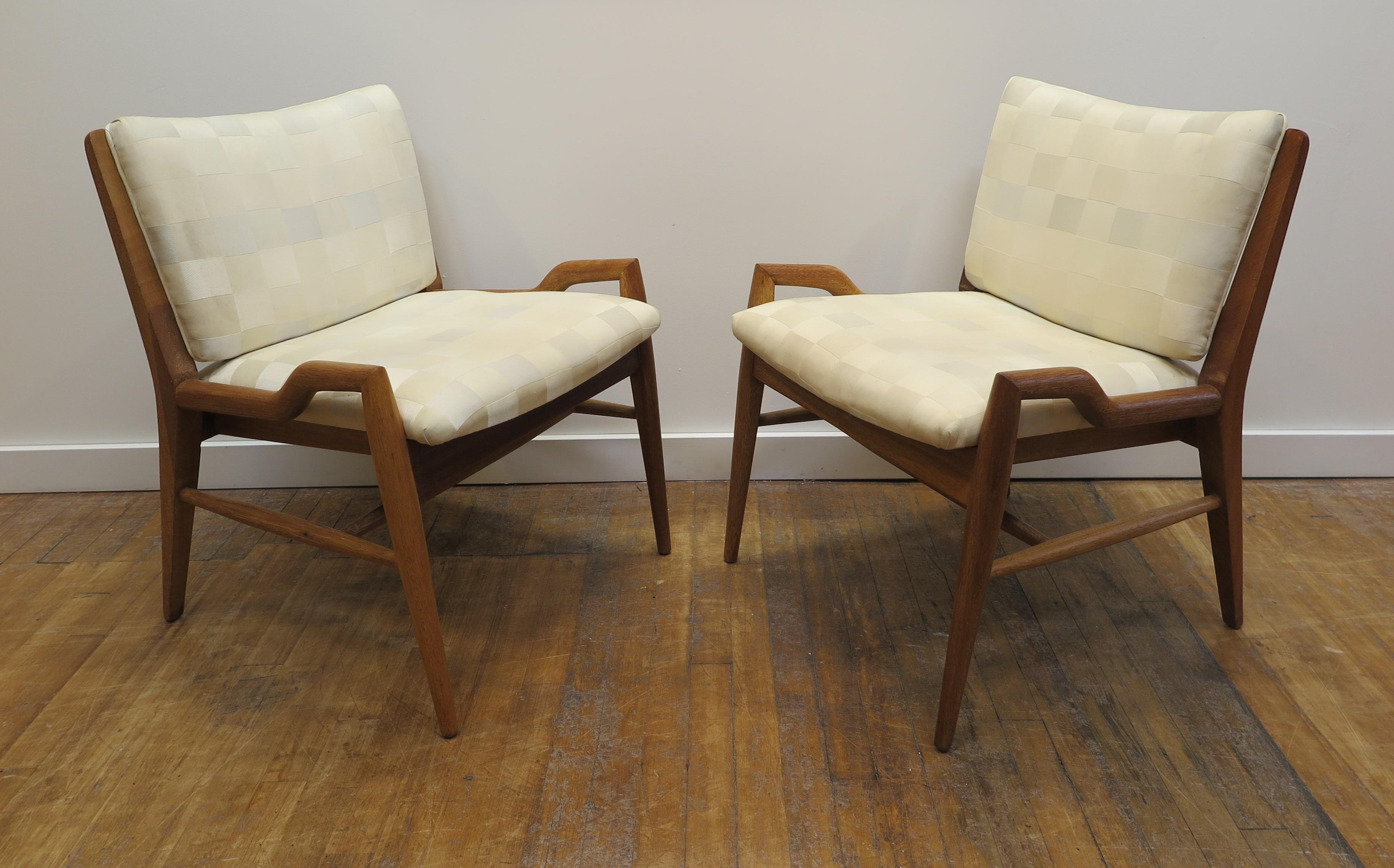 John Keal low arm chairs. John Keal low arm chairs in Mahogany. One of John Keal's most coveted and sought after designs are these low arm chairs. Many times used in dining chair sets as head chairs, also sold and used as occasional chairs, side