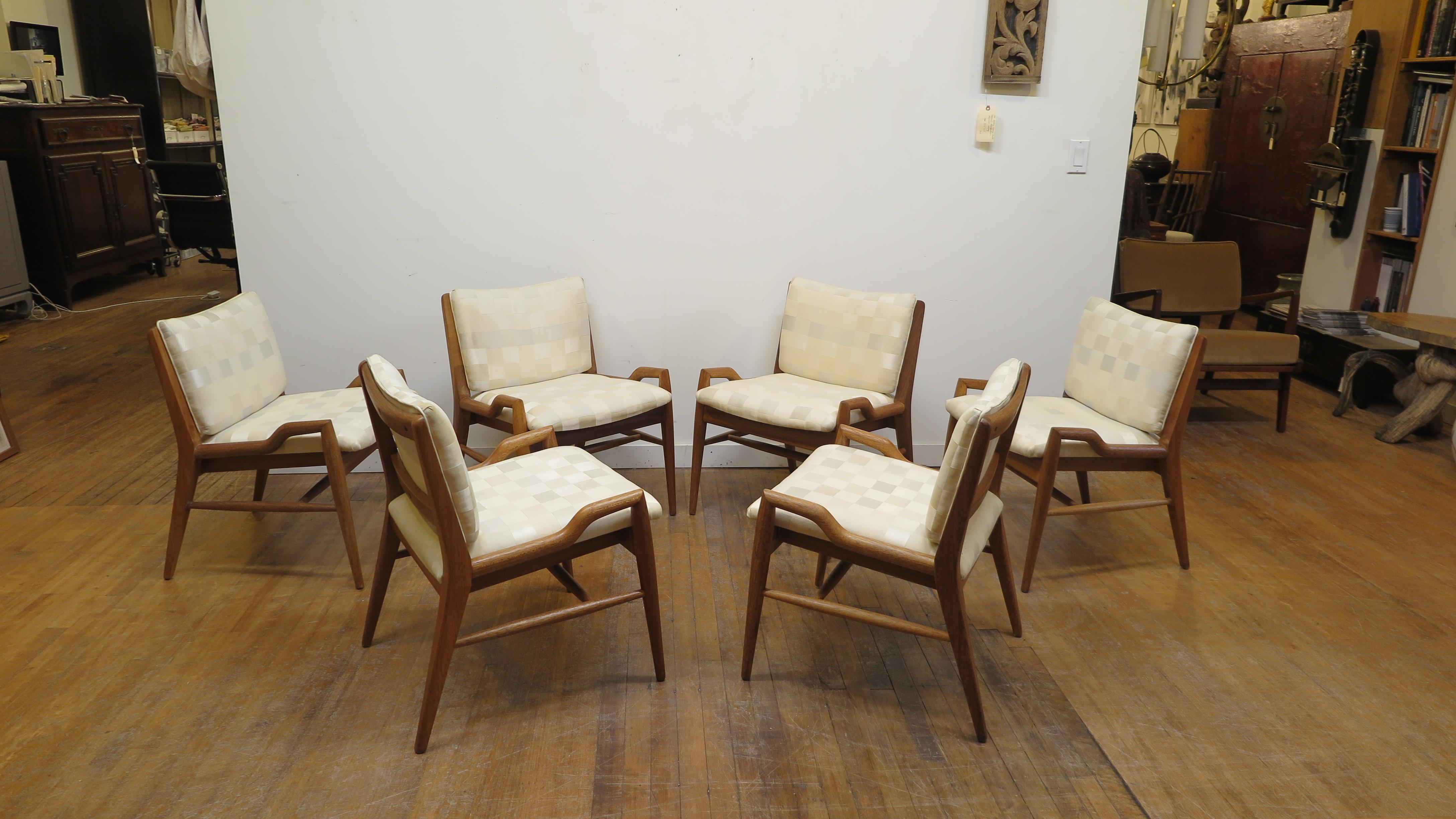 John Keal low arm chairs. John Keal low arm chairs in Cerused Mahogany. One of John Keal's most coveted and sought after designs are these low arm chairs. Many times used in dining chair sets as head chairs, also sold and used as occasional chairs