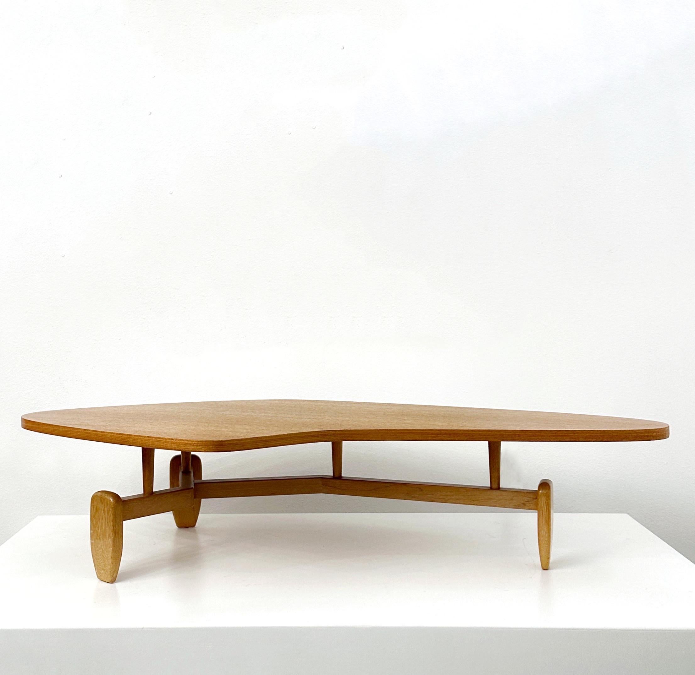 Large and unique biomorphic coffee table designed by John Keal for Brown Saltman of California in the 1950s. This is one of those iconic tables that many people consider among their all-time favorite designs. The unusual shape creates the illusion