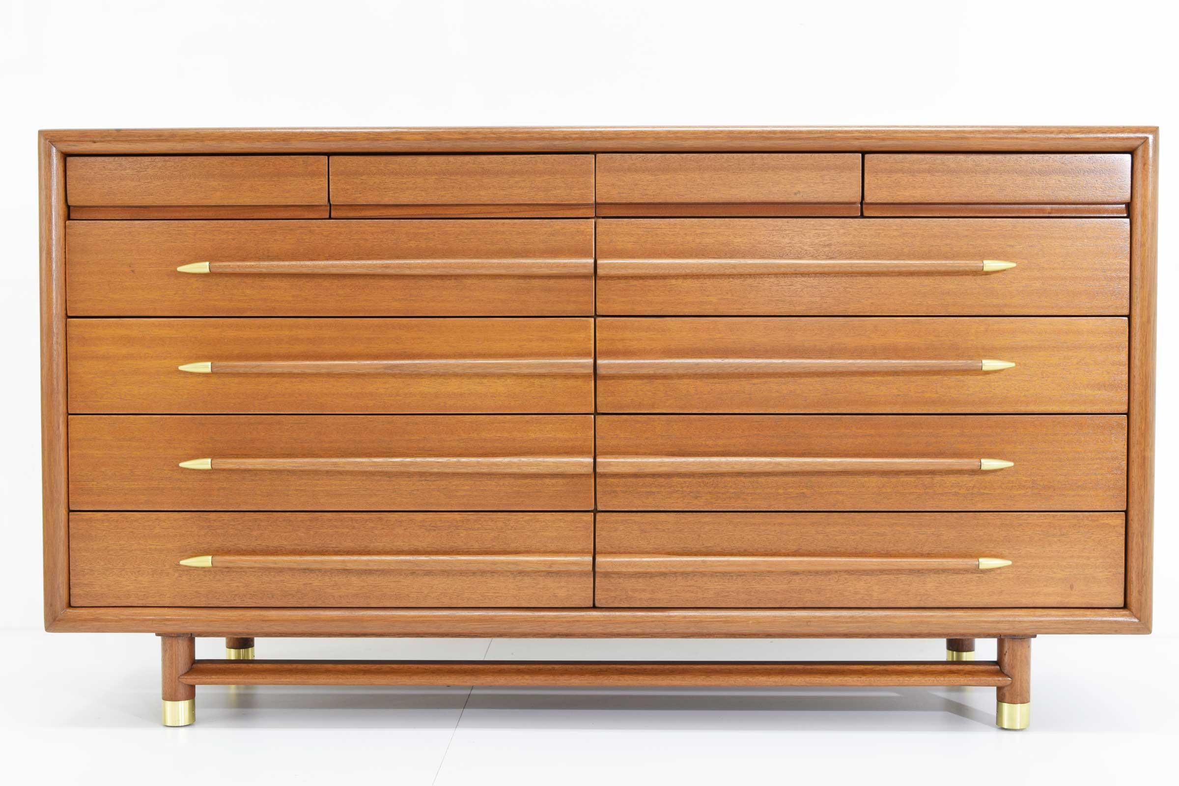 Beautifully restored chest of drawers by John Keal. Walnut 12-drawer dresser with sculptural pulls terminating in polished metal tips by John Keal for Brown-Saltman, 1950s. Back stamped with 9013 and Mr. & Mrs. A substantial piece with brass sabots