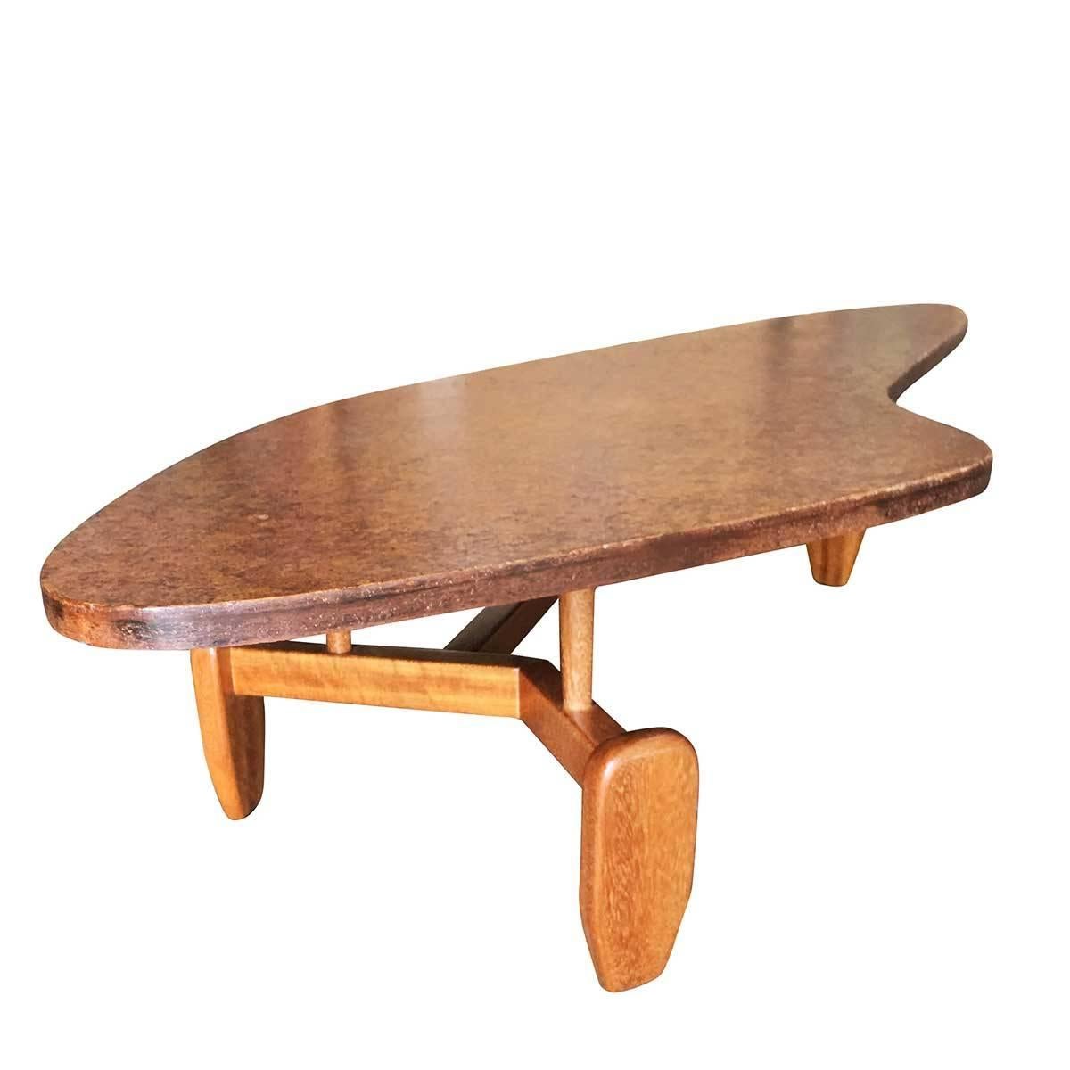 This is one of the most interesting pieces designed by John Keal for Brown Saltman. The amoeba or boomerang shaped top that has an almost cork look to it. The sculptural legs and spacers, that give the top an almost floating look, are done in