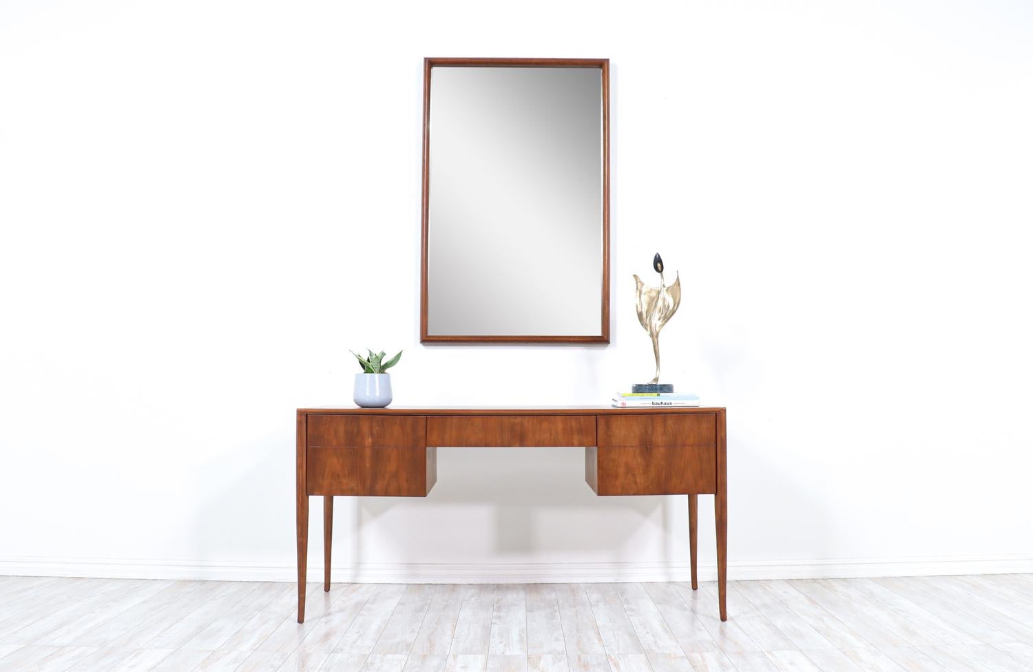 John Keal wall-hanging sculpted mirror for Brown Saltman.

________________________________________

Transforming a piece of Mid-Century Modern furniture is like bringing history back to life, and we take this journey with passion and precision.